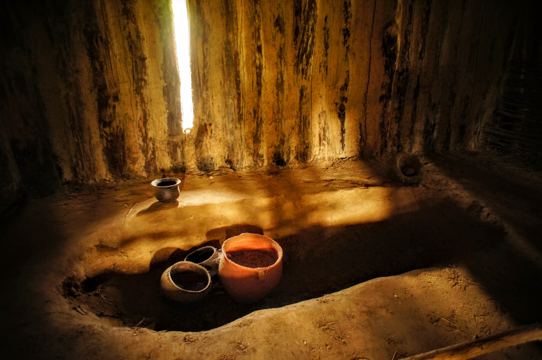 Sony Alpha NEX-3 sample photo. Reconstruction of the neolithic hut, biskupin photography