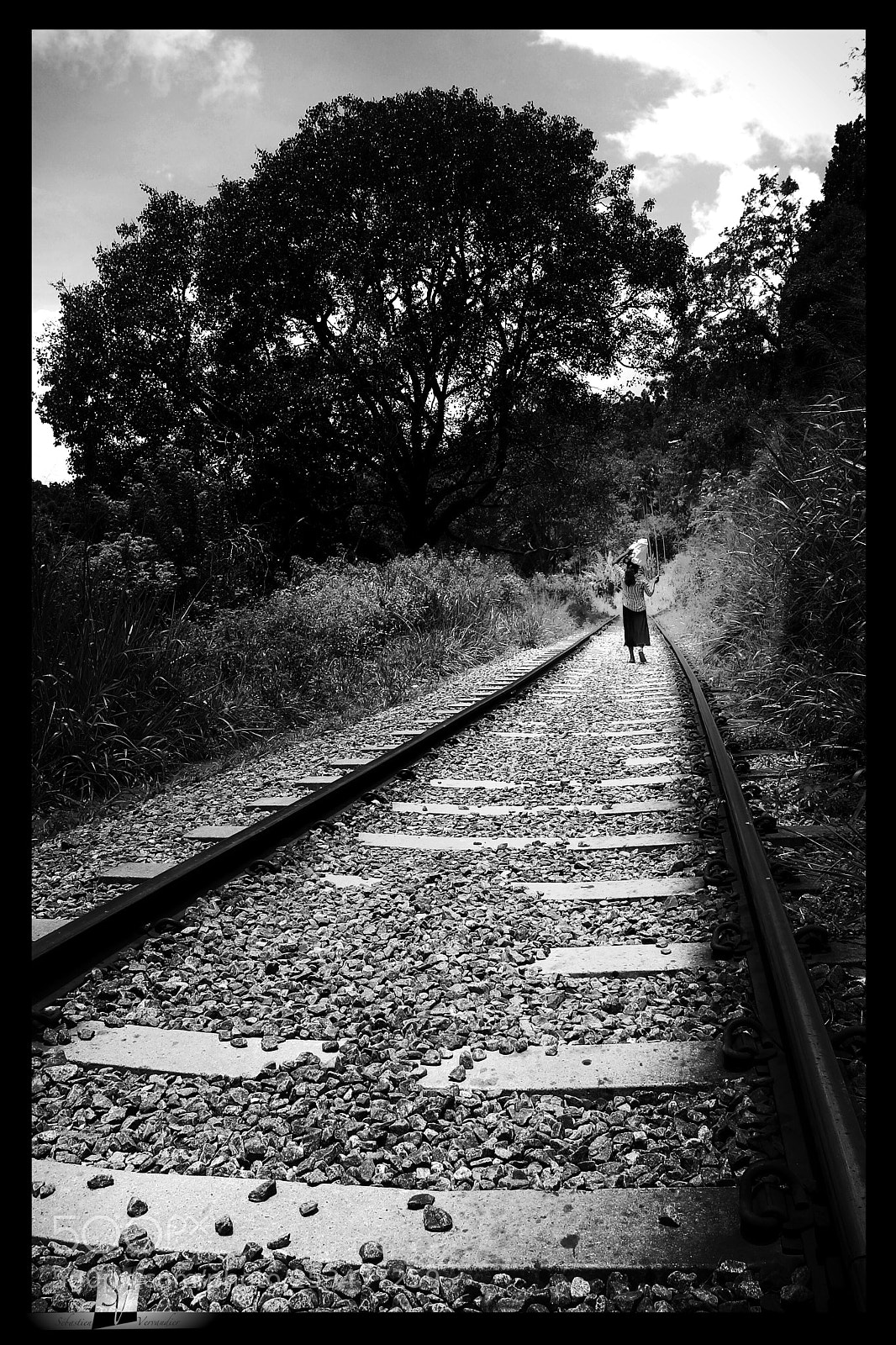 Canon EOS 6D Mark II sample photo. Woman on rail tracks photography