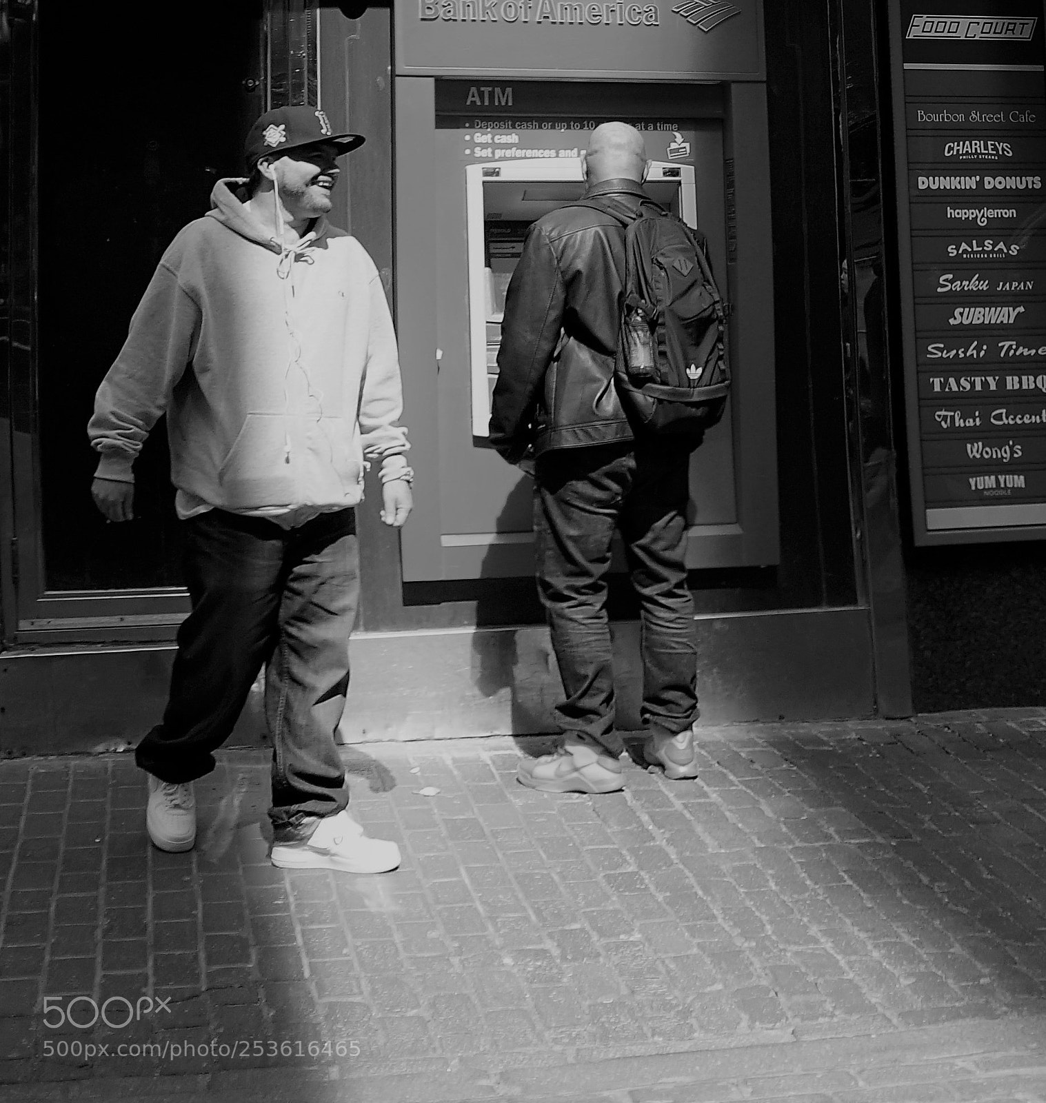 Sony a6500 sample photo. Two guys getting money photography