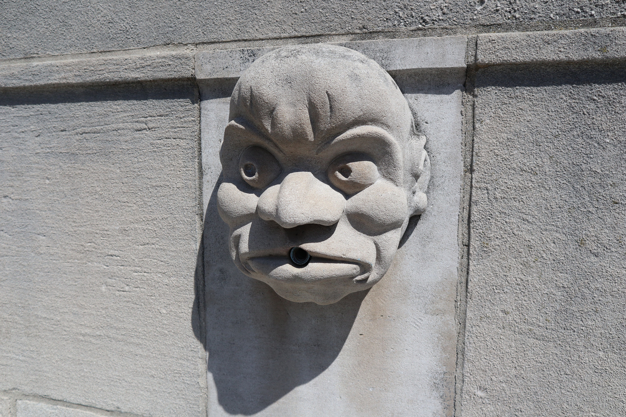 Canon EOS M100 sample photo. A face for masonry photography