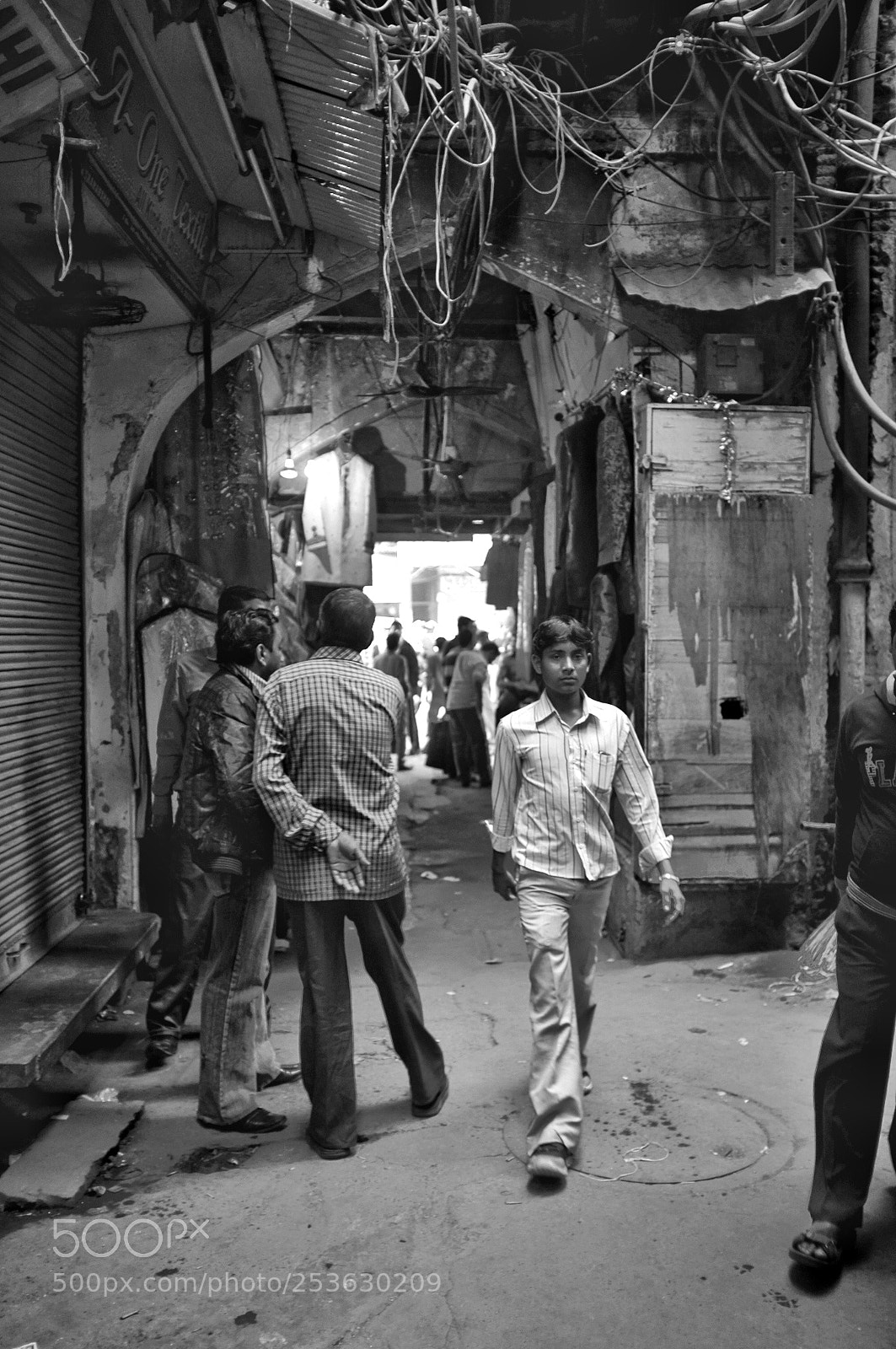 Fujifilm FinePix X100 sample photo. Young man in alley photography
