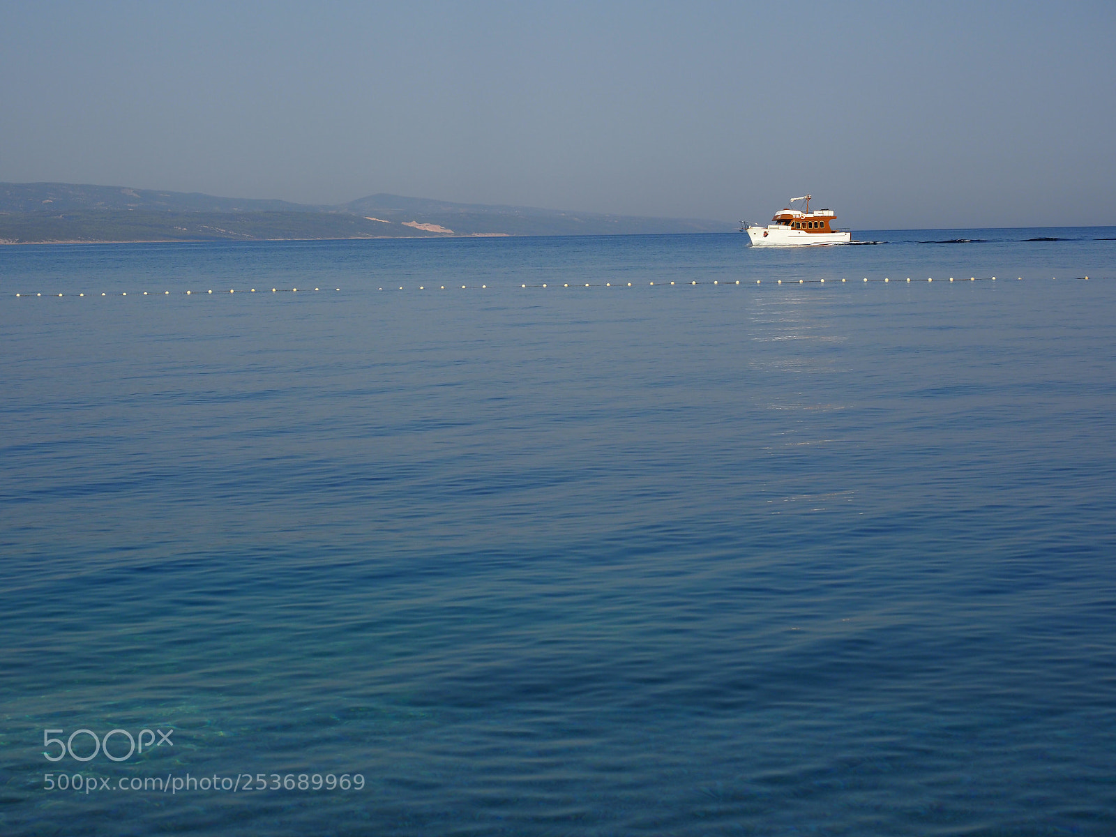 Olympus OM-D E-M1 Mark II sample photo. A boat behind the photography