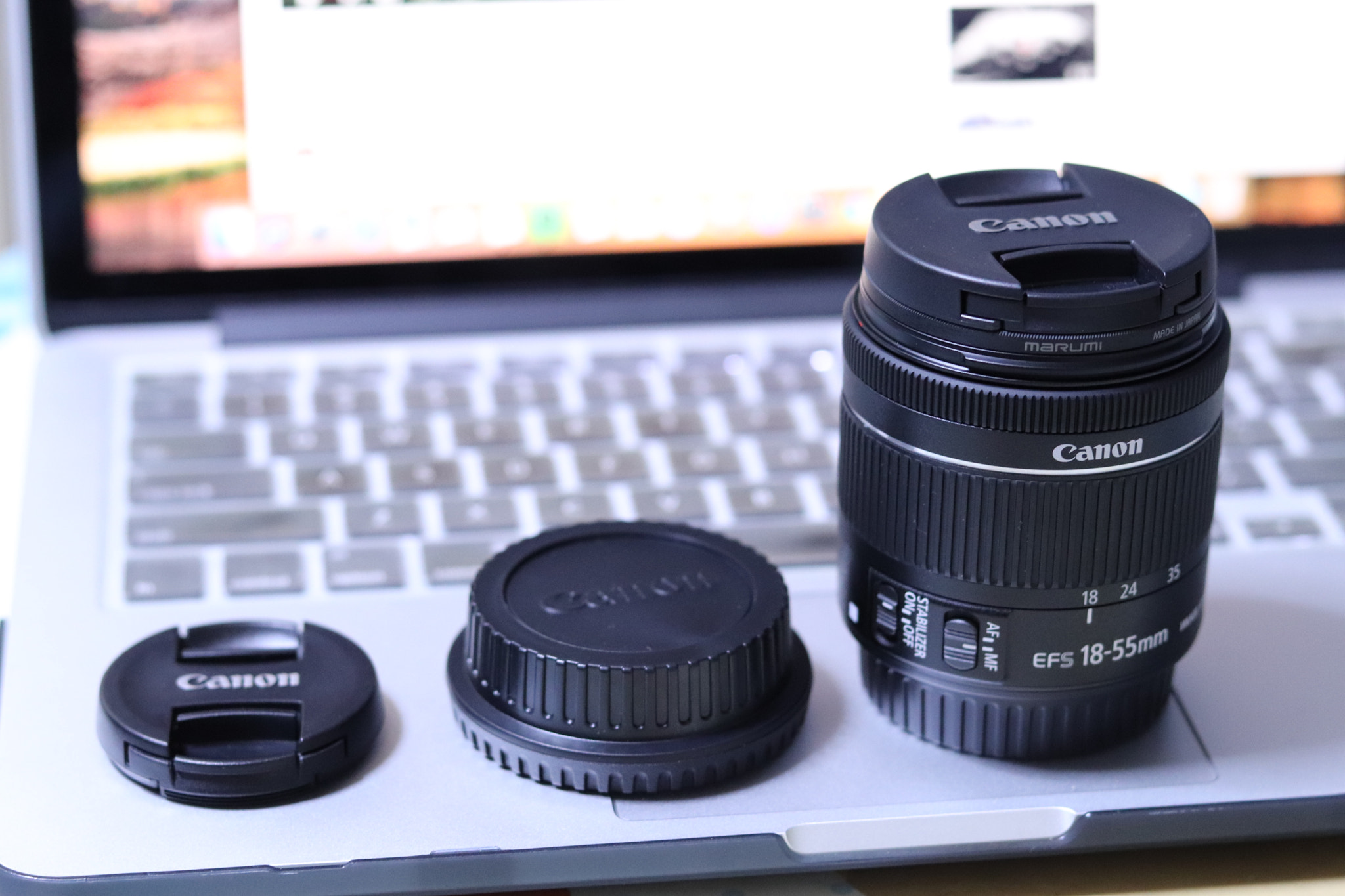 Canon EOS 200D (EOS Rebel SL2 / EOS Kiss X9) + Canon EF 50mm F1.8 STM sample photo. The cap and the lens photography