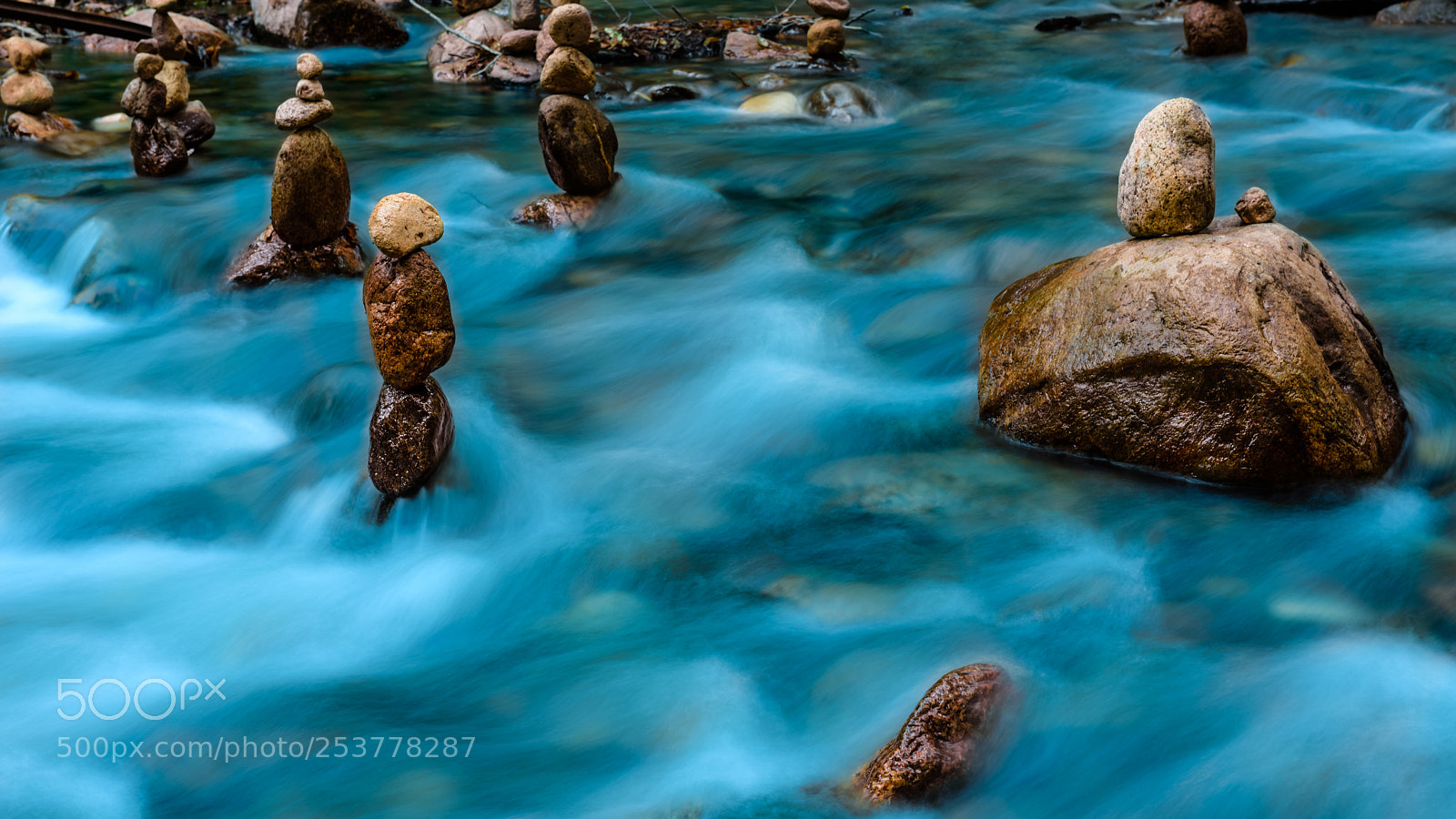 Nikon D810 sample photo. Balanced rocks against flowing photography