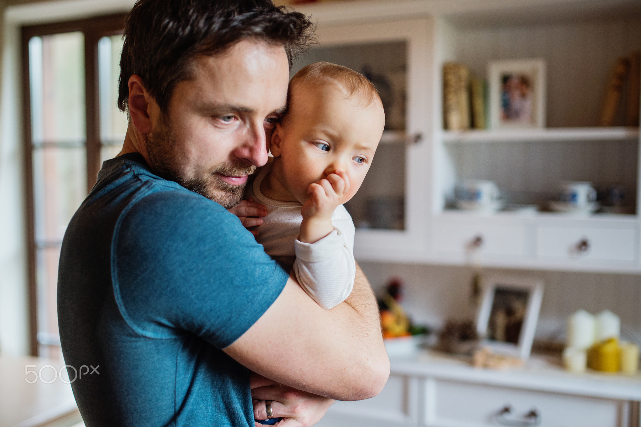 Father with a baby girl at home.