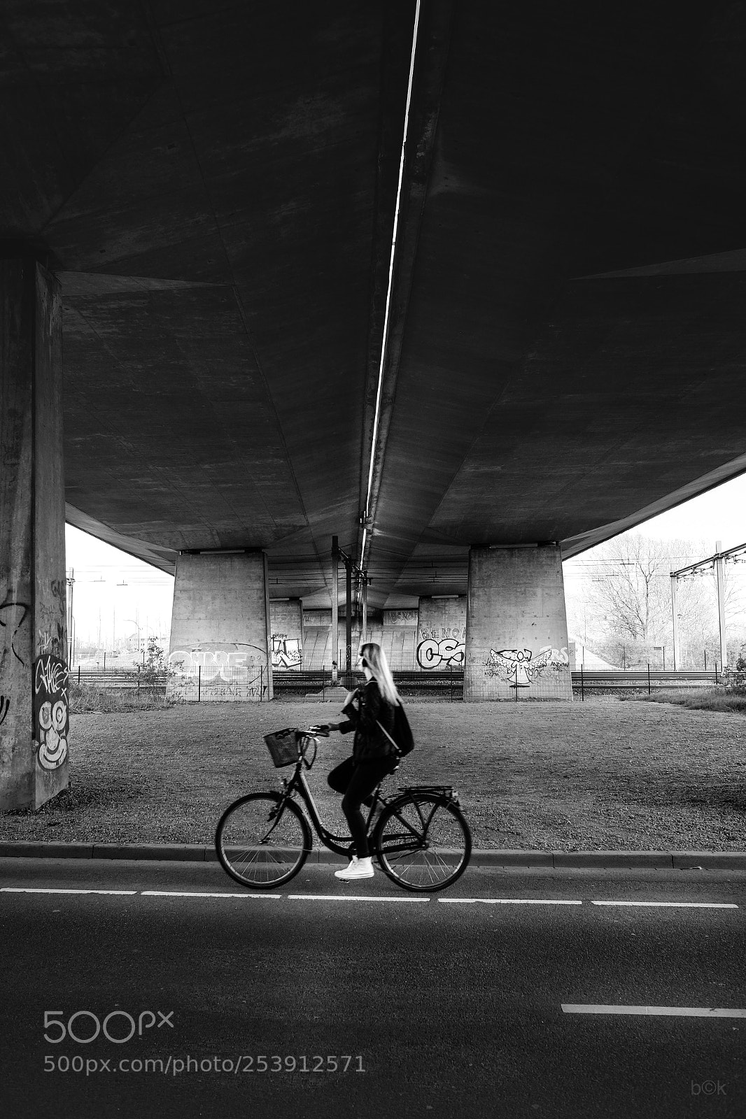 Fujifilm X70 sample photo. Biking under the bridge photography