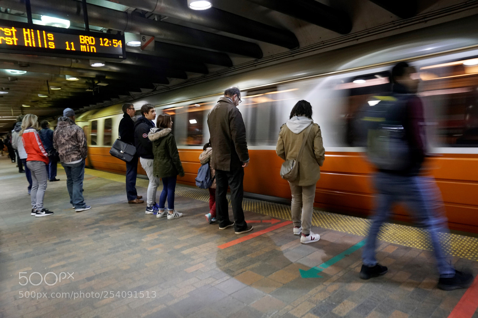 Sony a6500 sample photo. Orange line train arrives photography
