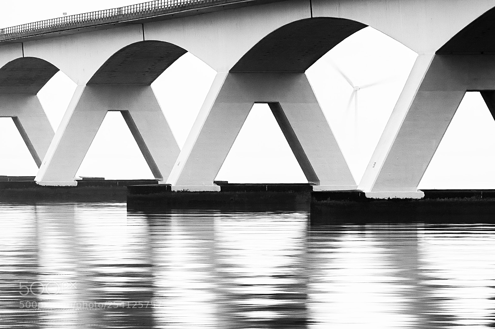 Sony ILCA-77M2 sample photo. Wind under the bridge photography