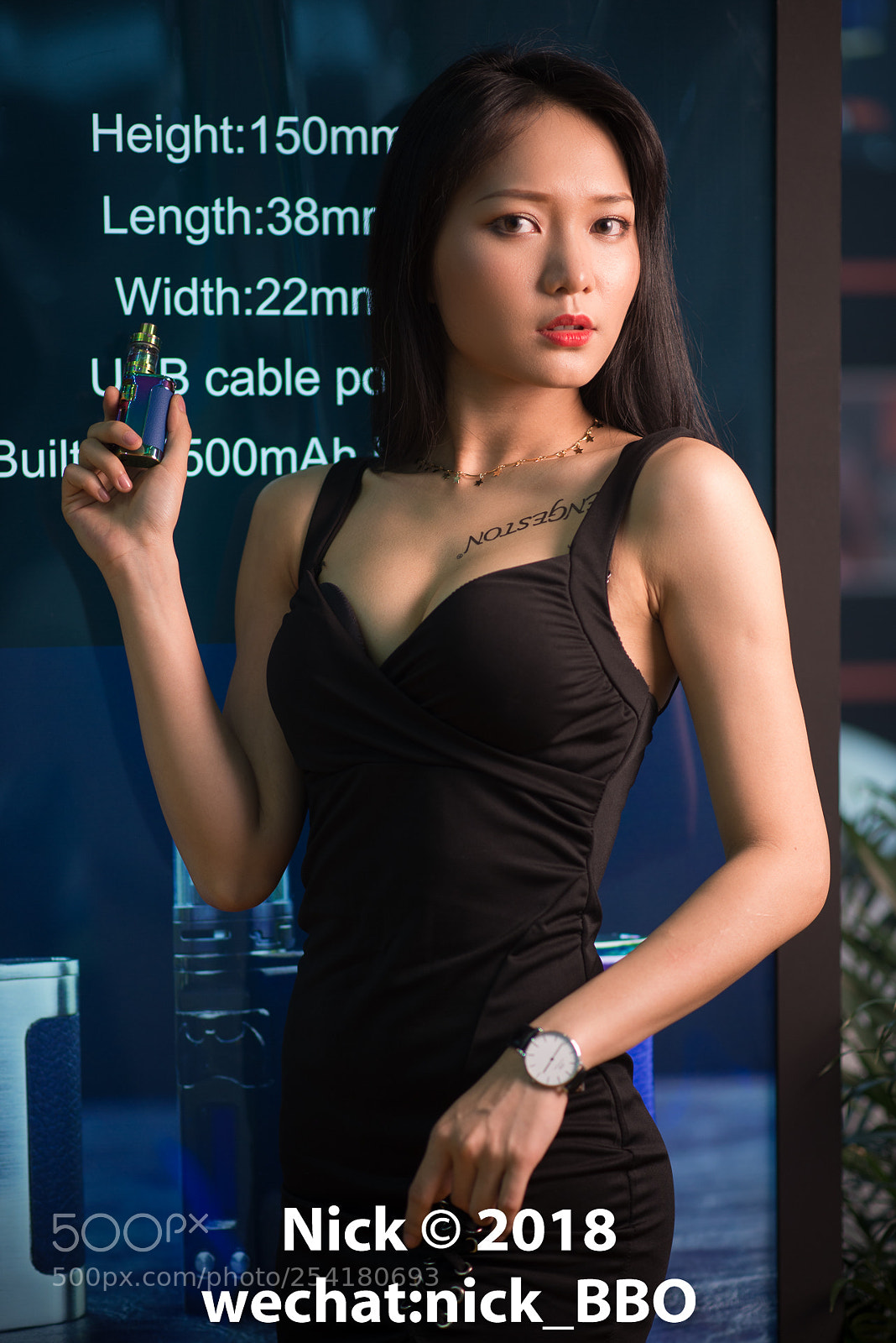 Nikon D610 sample photo. Model at e-cig exhibition photography