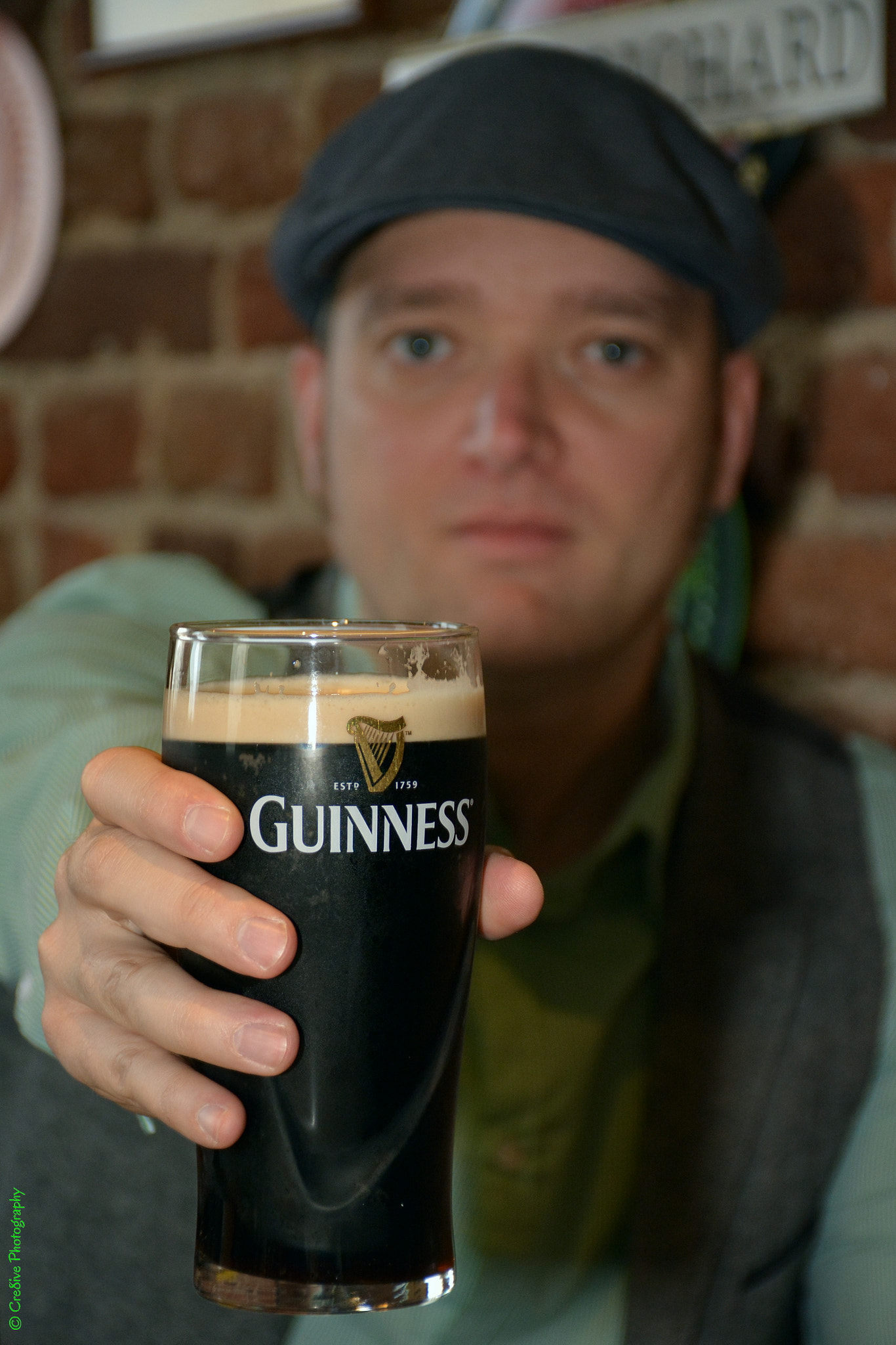 Nikon D5200 sample photo. Saluting with a pint of guinness photography