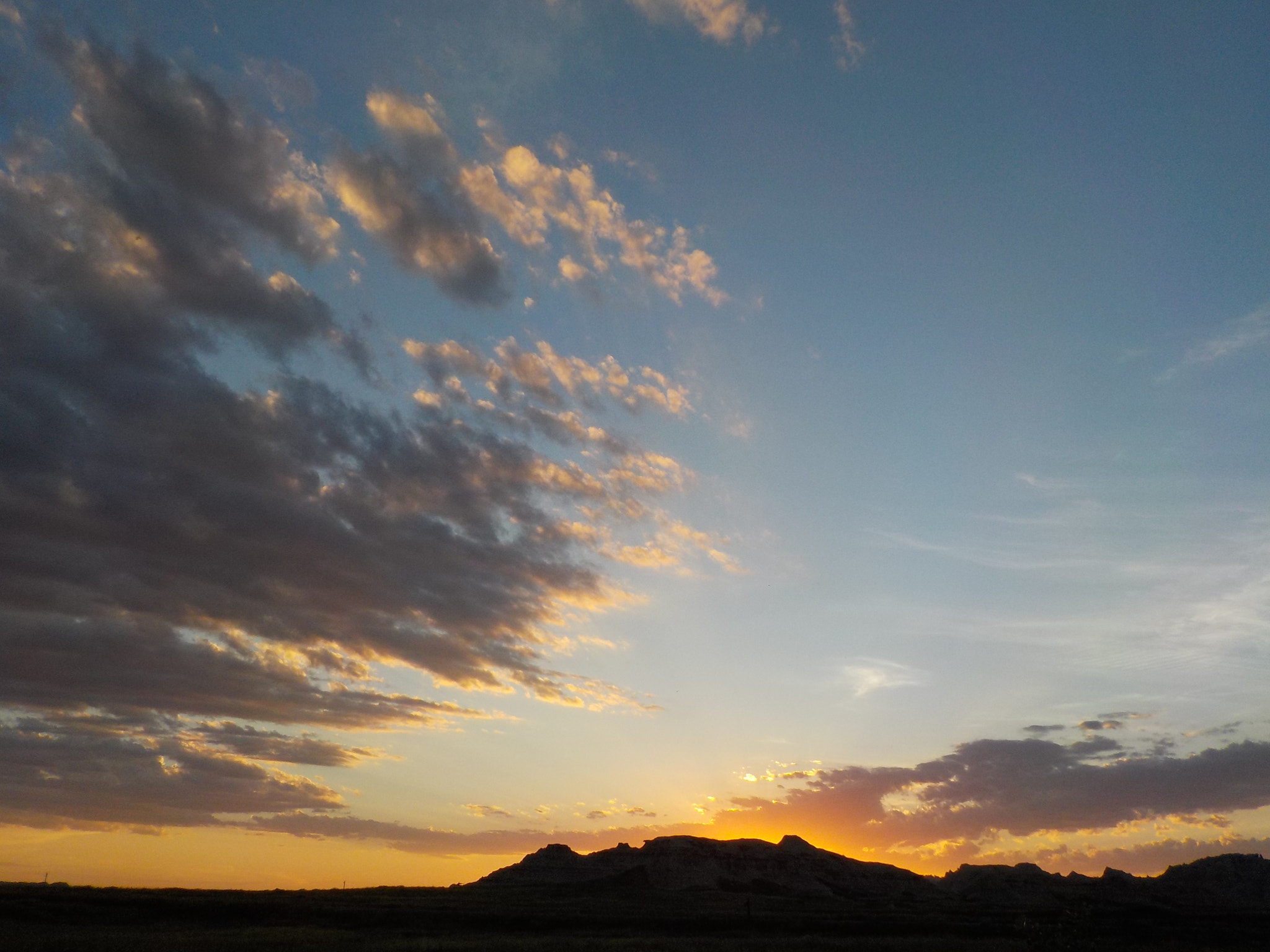 Nikon Coolpix S33 sample photo. Sunset over mountain with lots of clouds photography