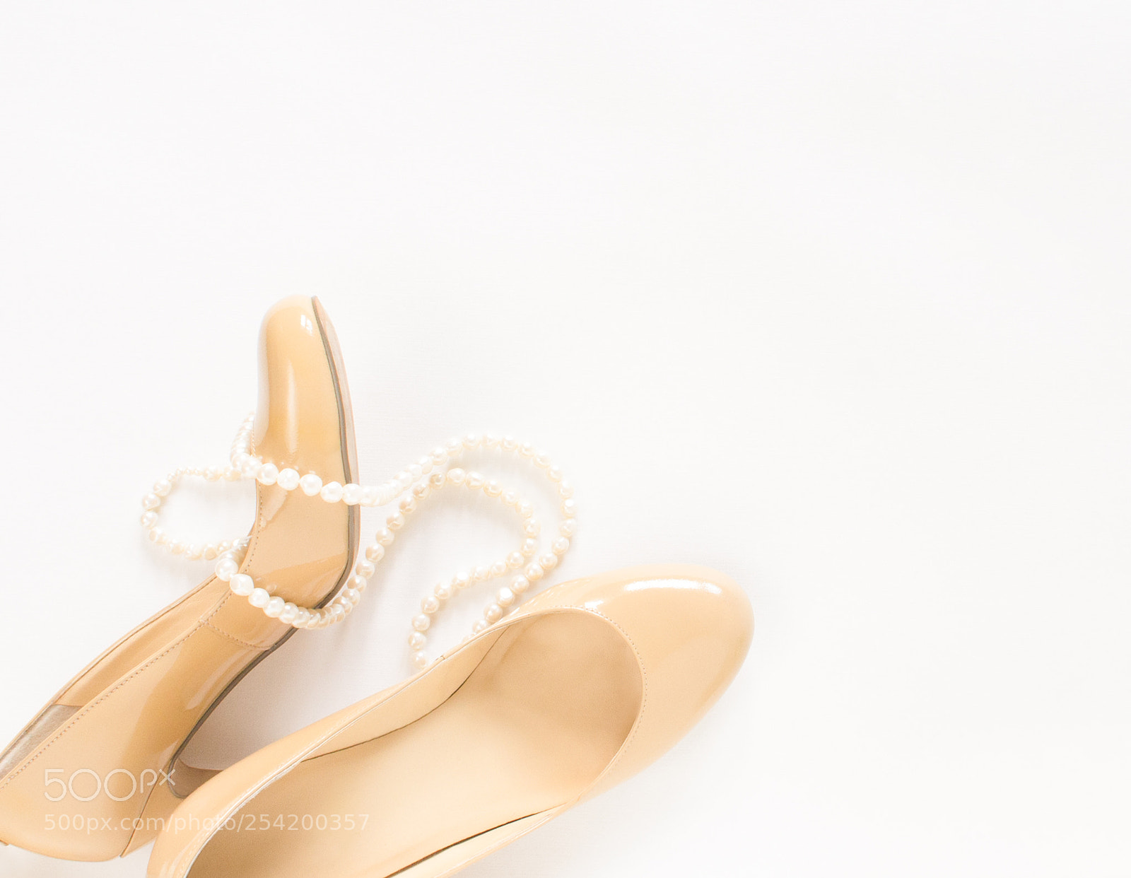 Sony Alpha NEX-5 sample photo. Cream heeled women's shoes photography