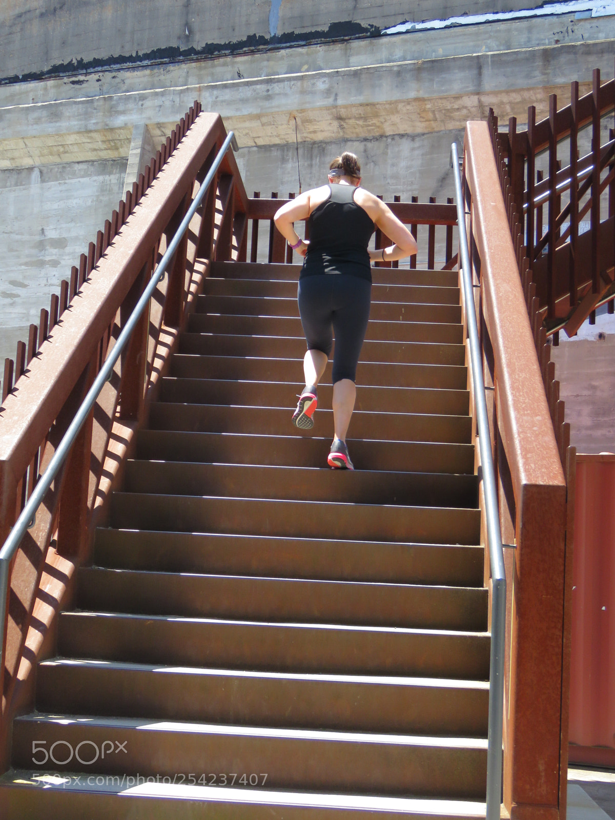 Canon PowerShot SX60 HS sample photo. Female jogger climbing stairway photography