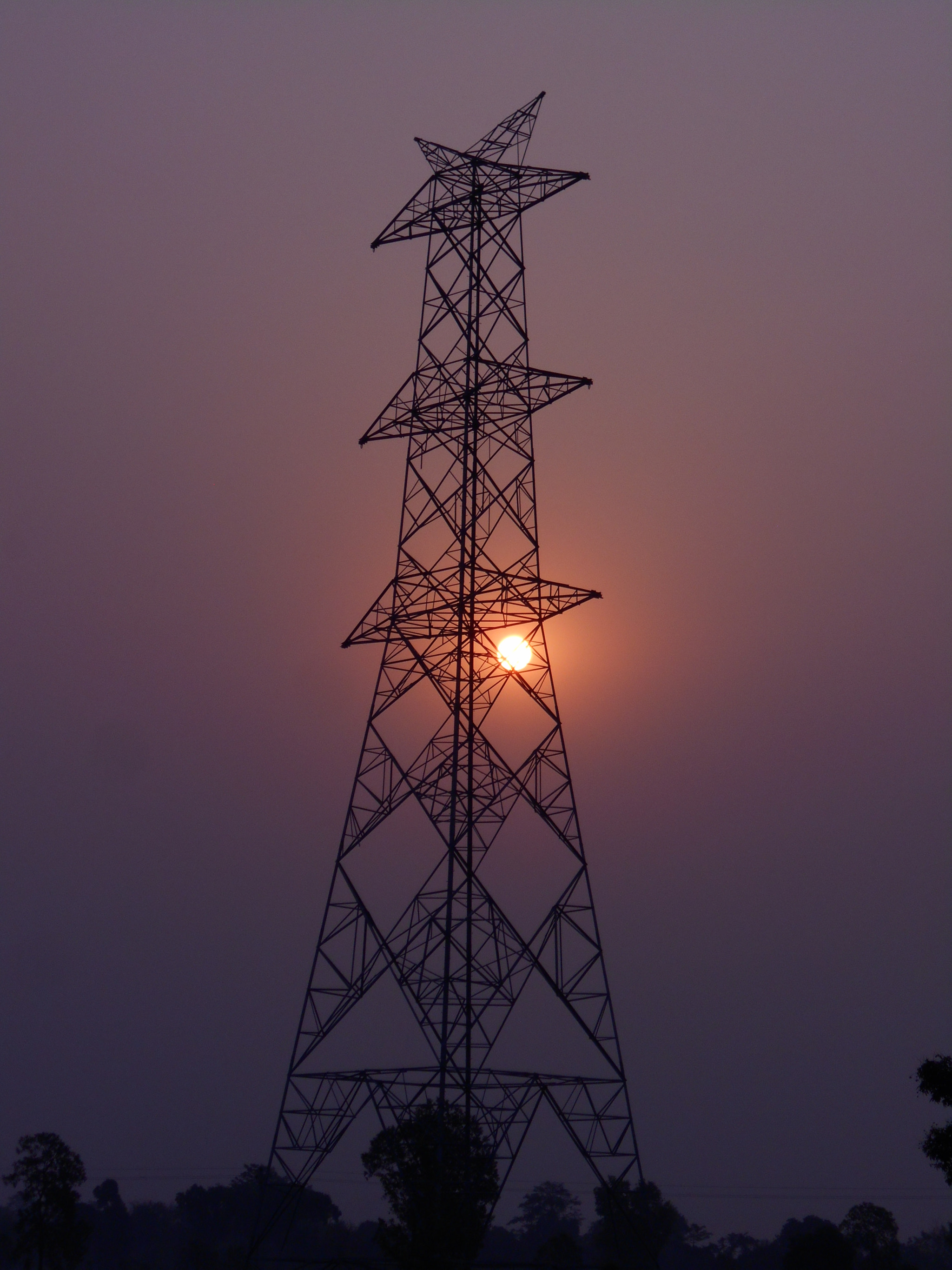 Nikon COOLPIX L30 sample photo. Sunrise through electric tower photography