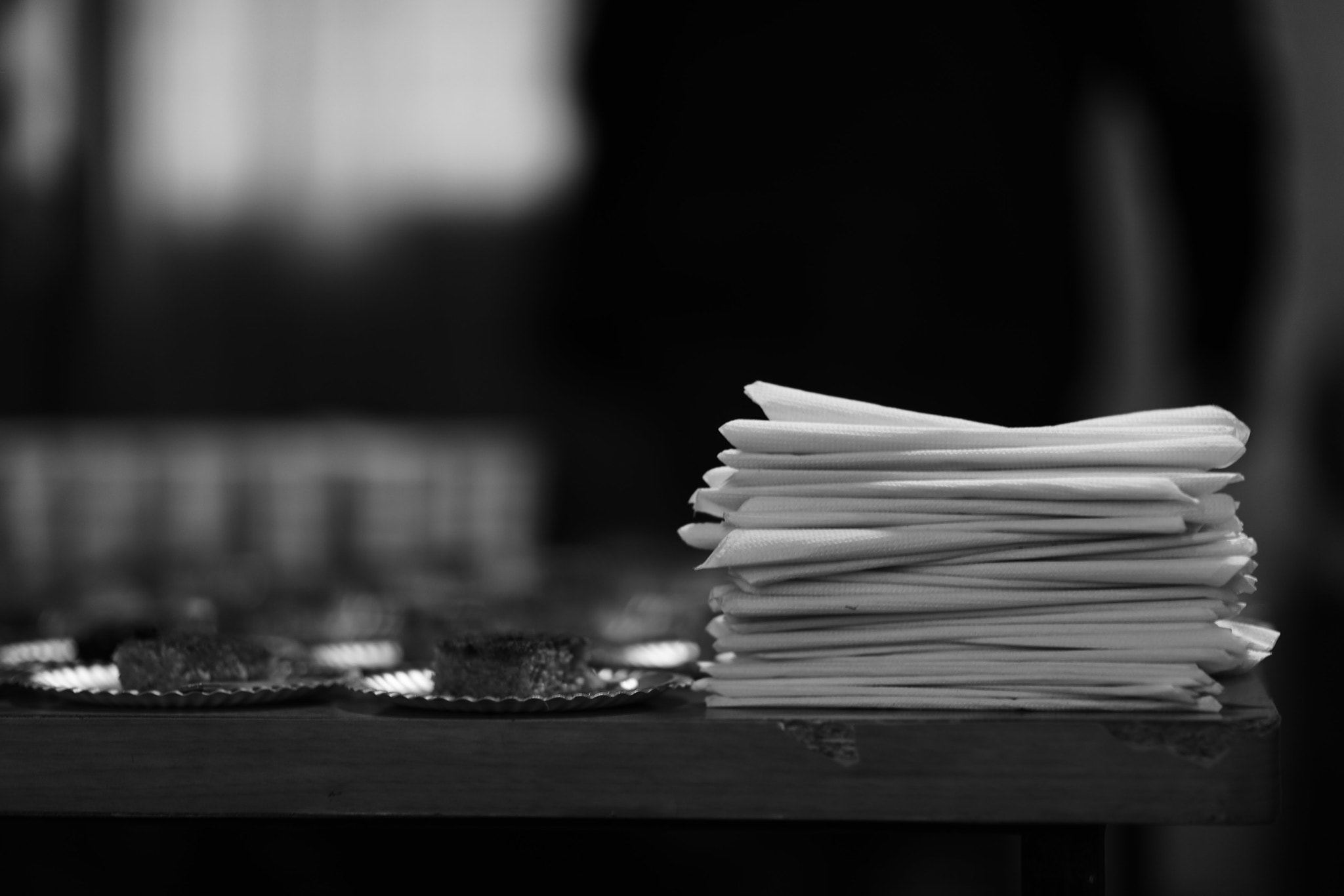 Canon EF 85mm F1.2L II USM sample photo. Papers on food table photography
