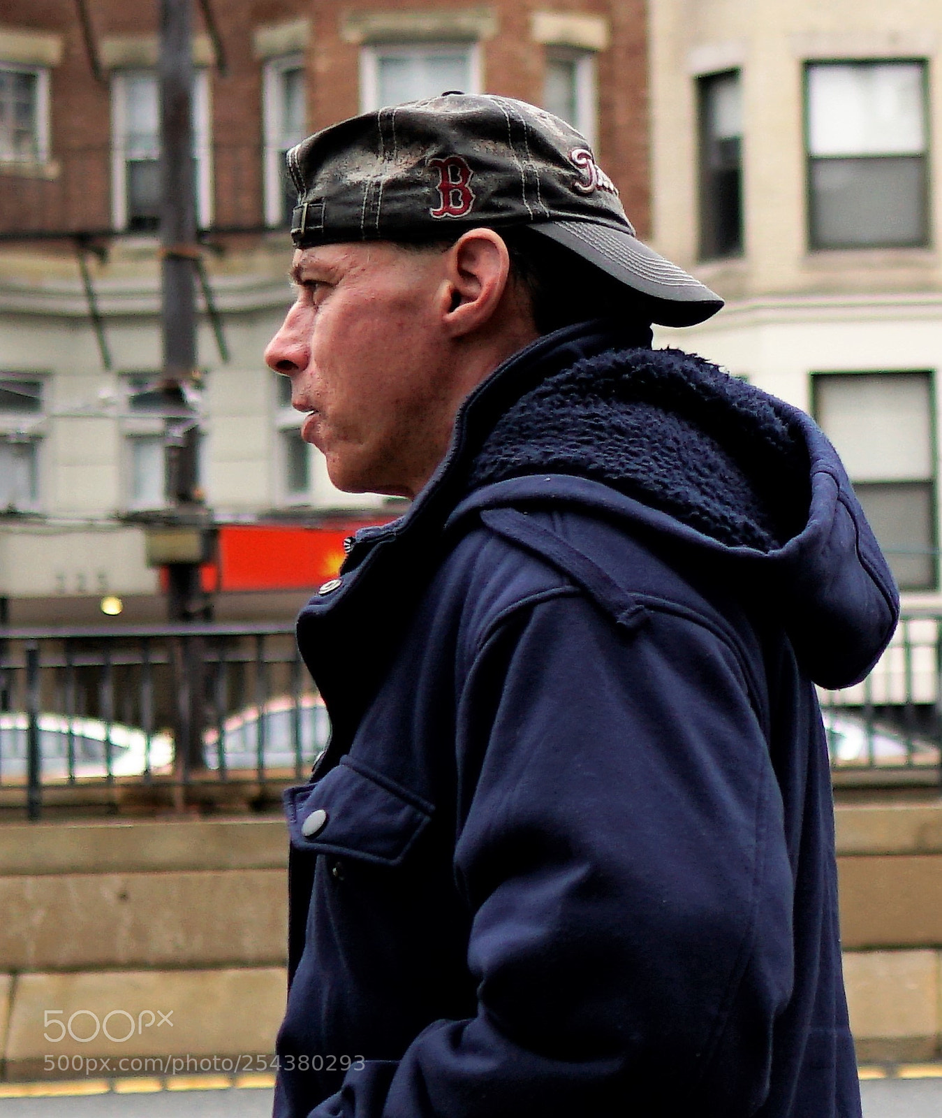 Sony a6500 sample photo. Red sox fan walking photography