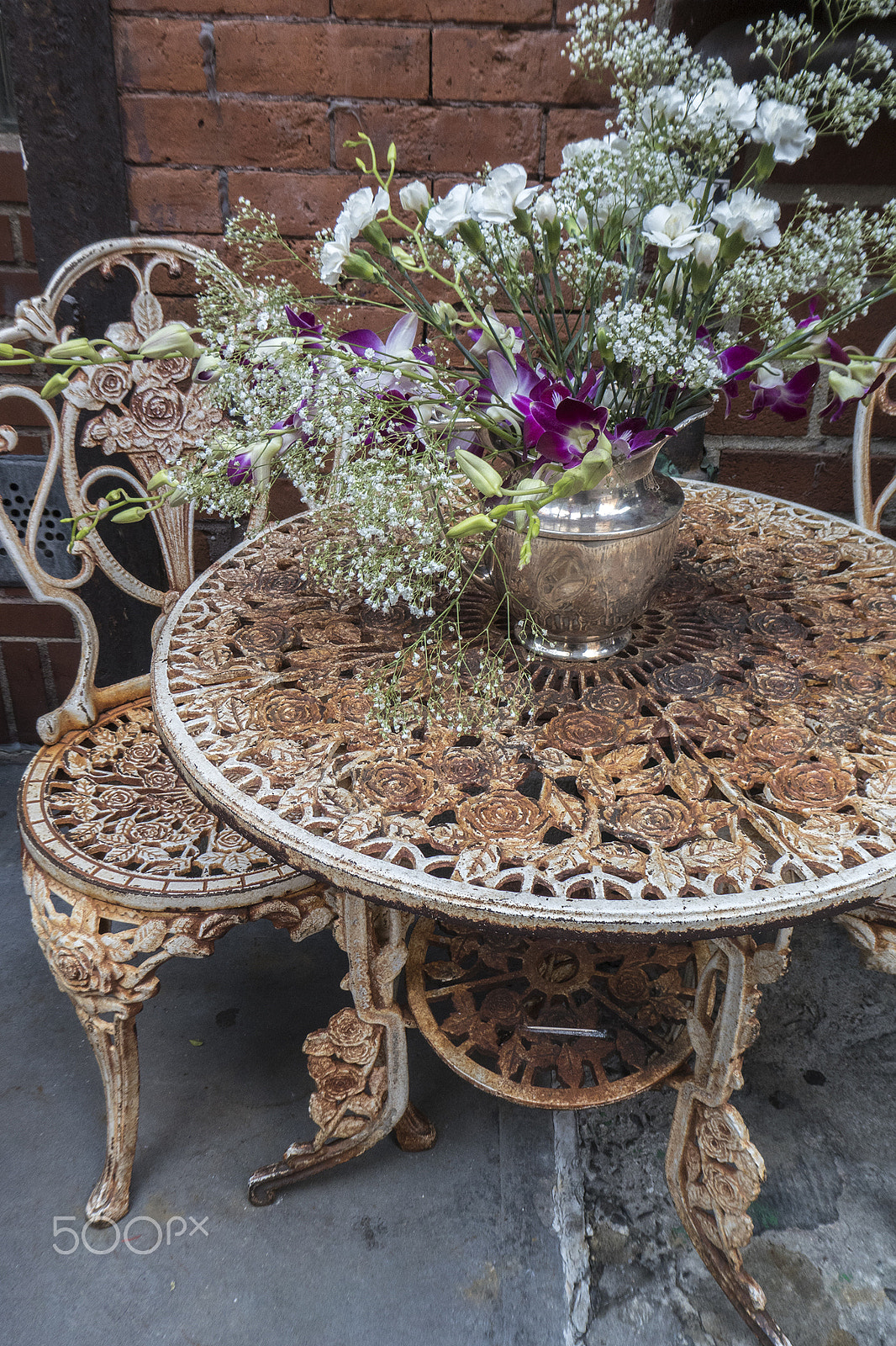 Panasonic DC-ZS70 sample photo. Rusty table & chair east village nyc photography