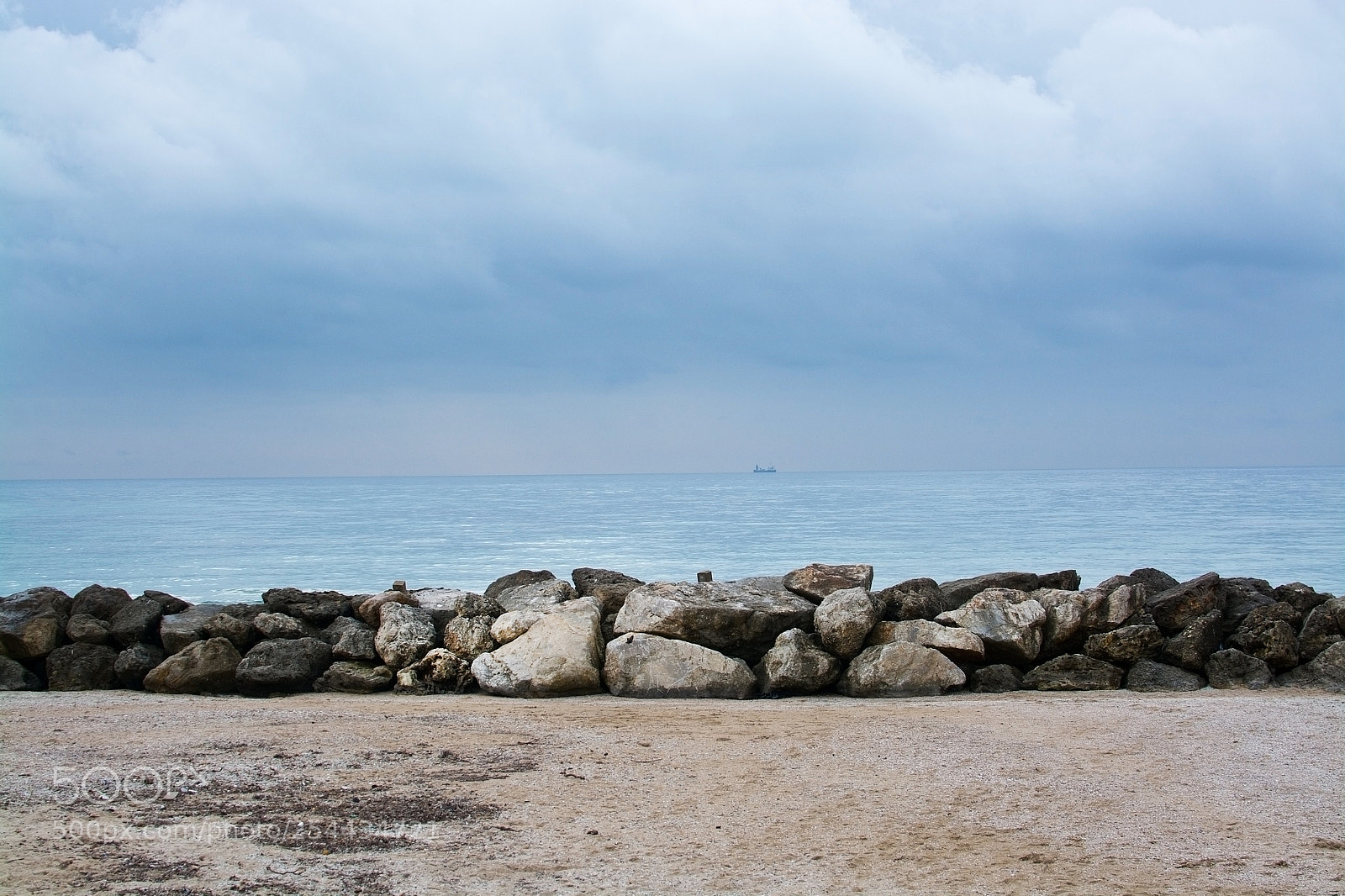 Nikon D7100 sample photo. Wavebreaker rocks and ship photography