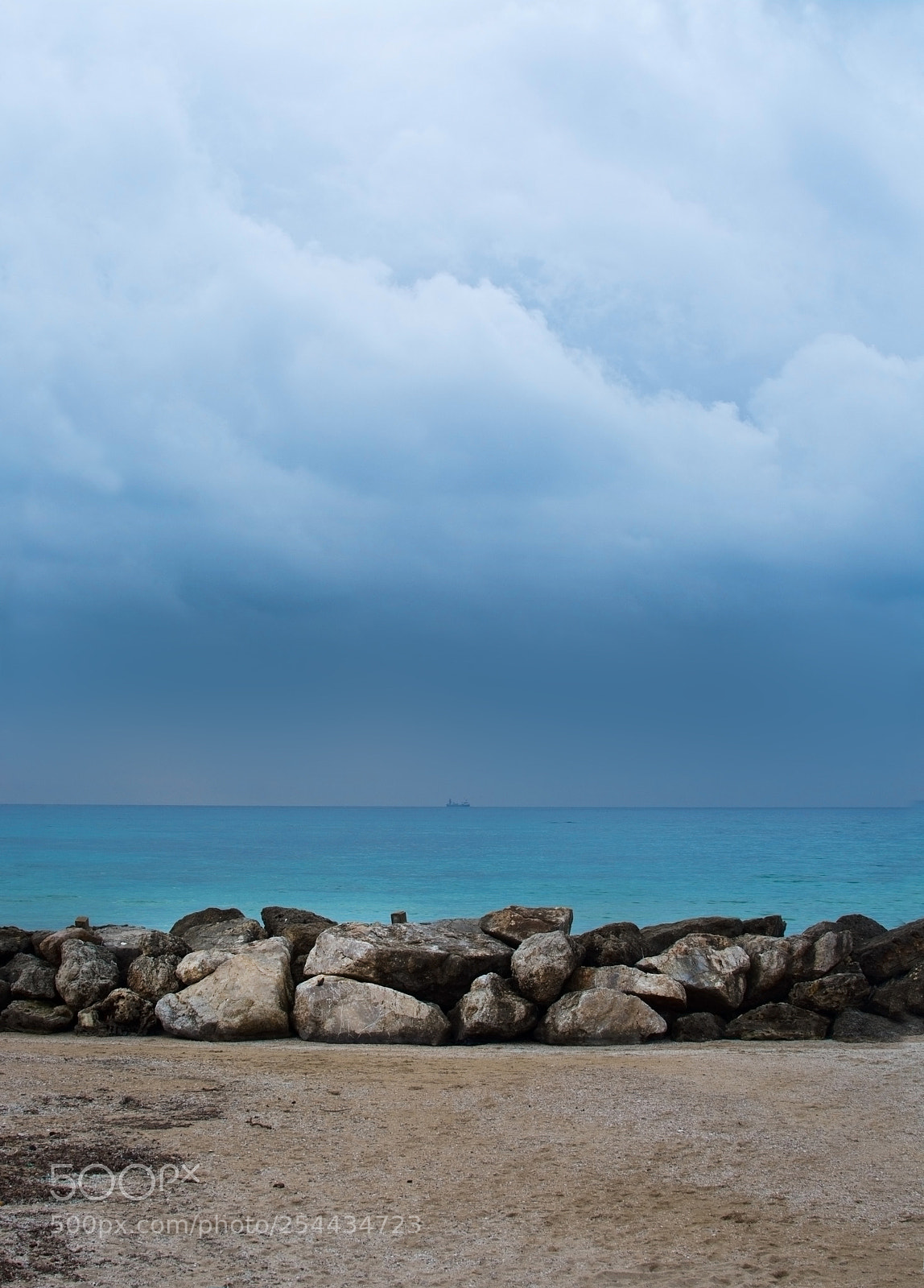 Nikon D7100 sample photo. Wavebreaker rocks and ship photography