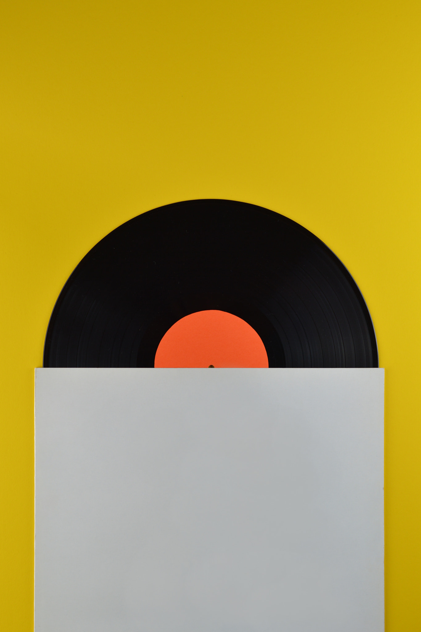 Nikon AF-S DX Micro Nikkor 40mm F2.8 sample photo. Half black vinyl record white blank cover photography