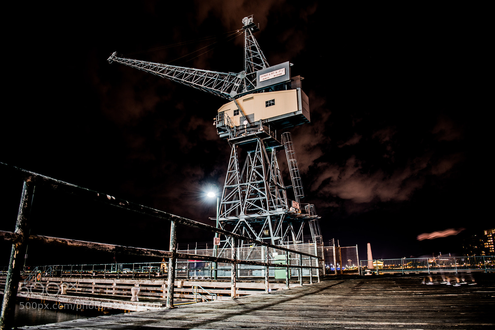 Nikon D810 sample photo. Lonely crane in harbor photography