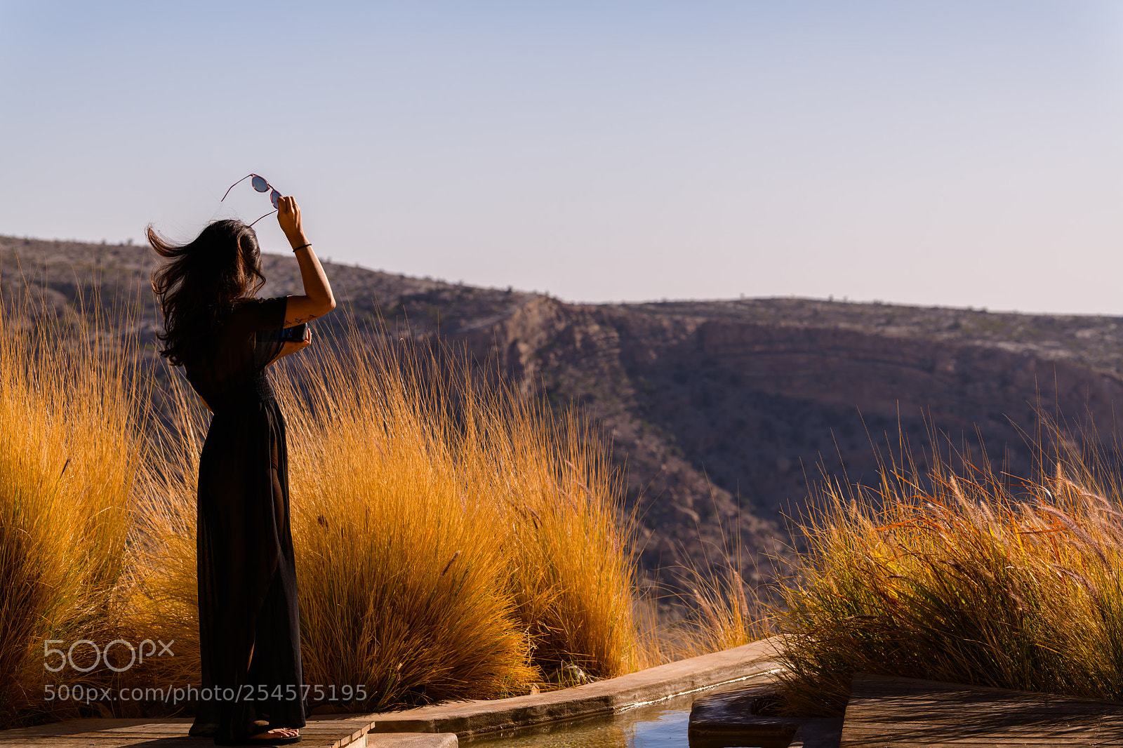 Nikon D850 sample photo. Woman enjoying windswept mountain photography