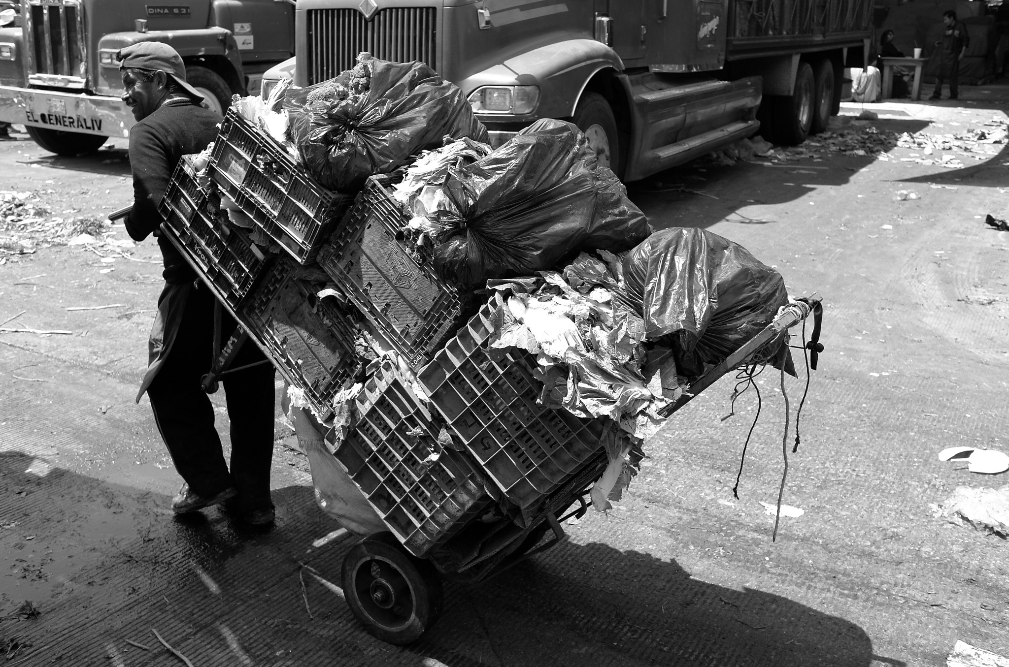 Leica X2 sample photo. Man carrying the garbage photography