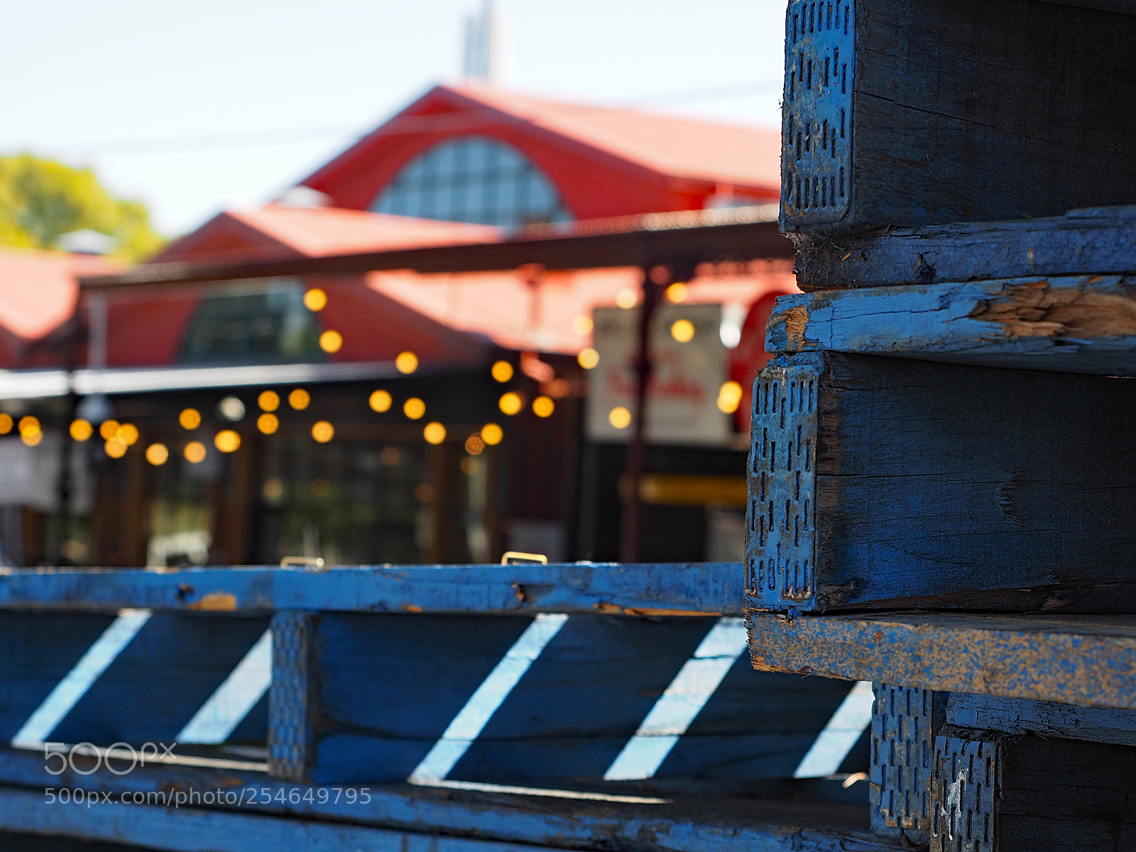 Olympus OM-D E-M5 II sample photo. Pallets are the market photography