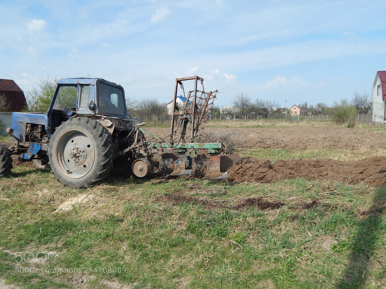 Nikon Coolpix L820 sample photo. Tractor plows the land photography