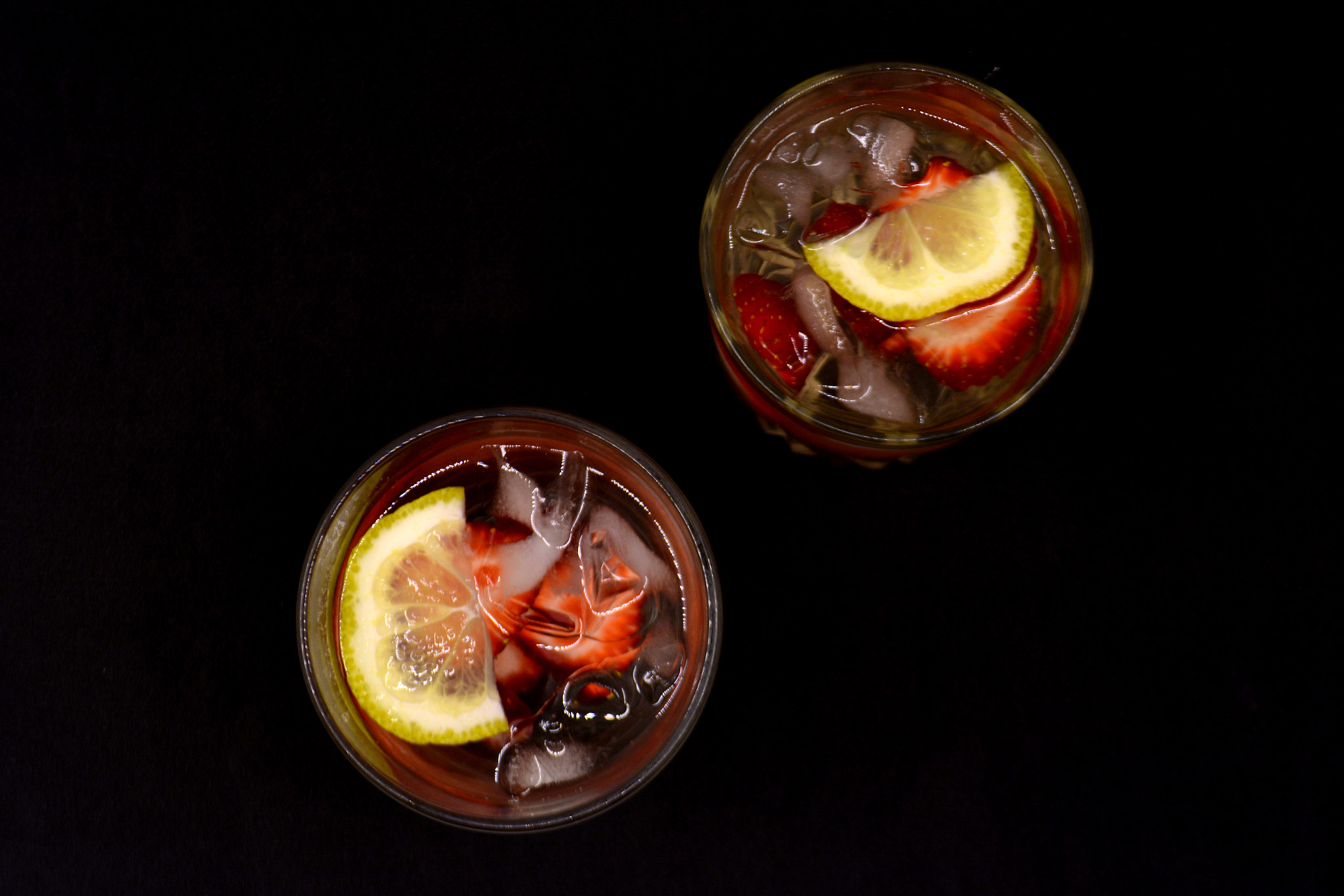 Nikon D7100 sample photo. Lemonade with strawberries on black background photography
