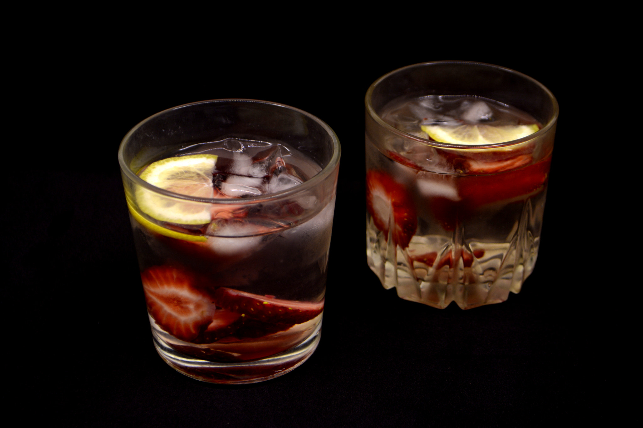 Nikon D7100 sample photo. Lemonade with strawberries on black background photography