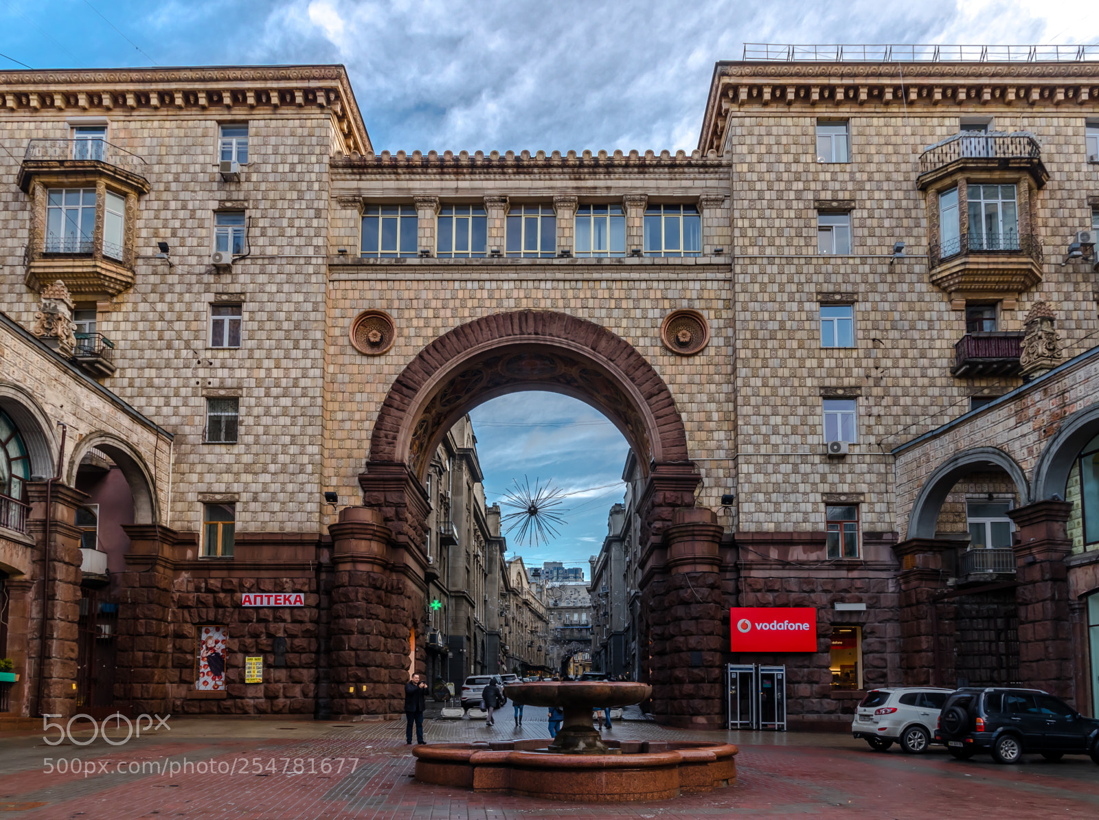 Canon EOS 80D sample photo. Gate behind fountain photography