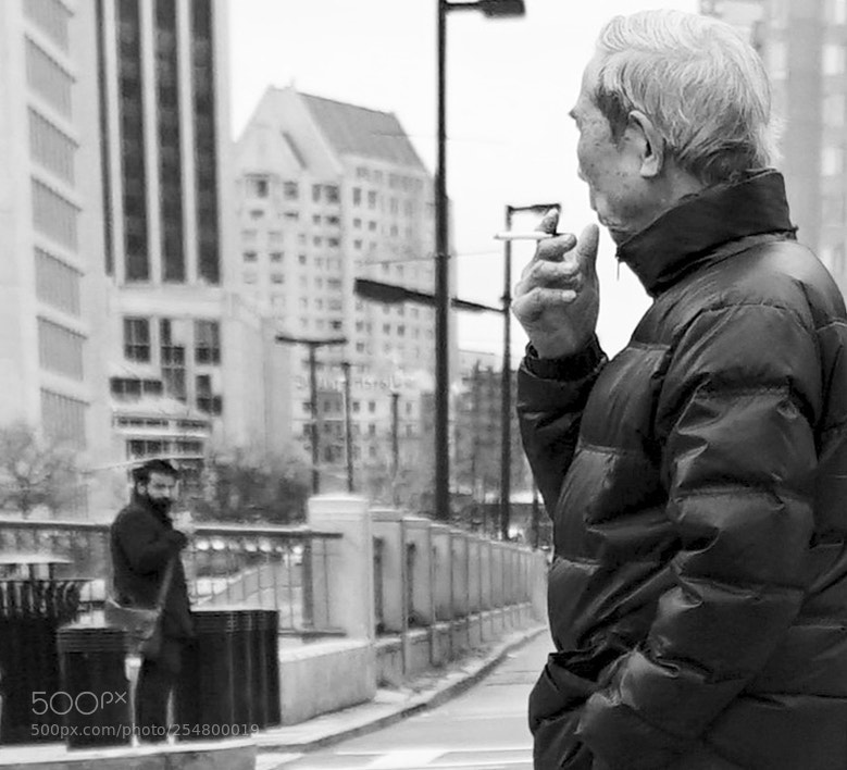 Sony a6500 sample photo. Two people looking at photography