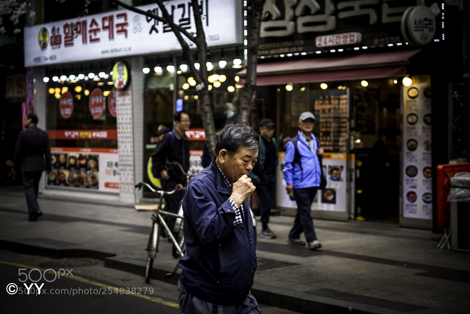 Nikon D610 sample photo. Man walking in seoul photography