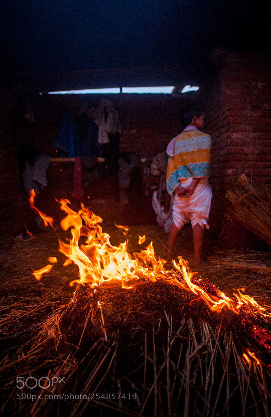 Nikon D700 sample photo. Devotees warm themselves photography