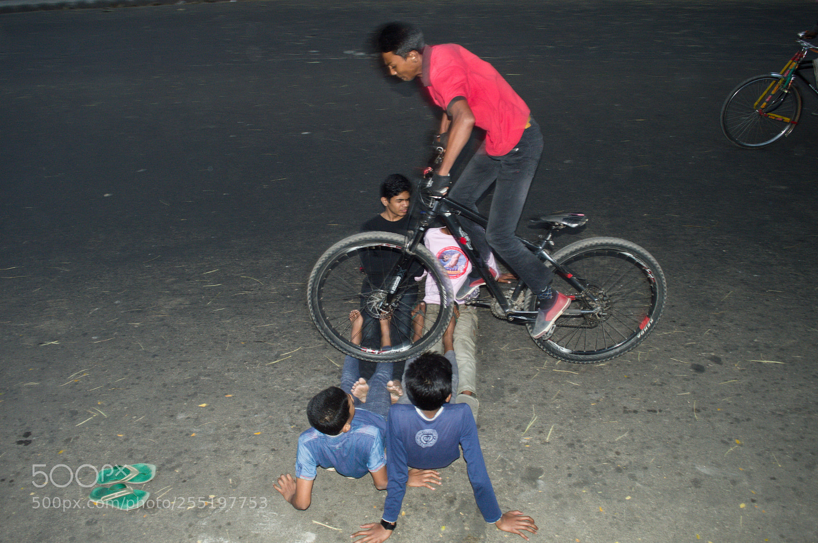 Nikon D3200 sample photo. Bicycle stunt over friends photography