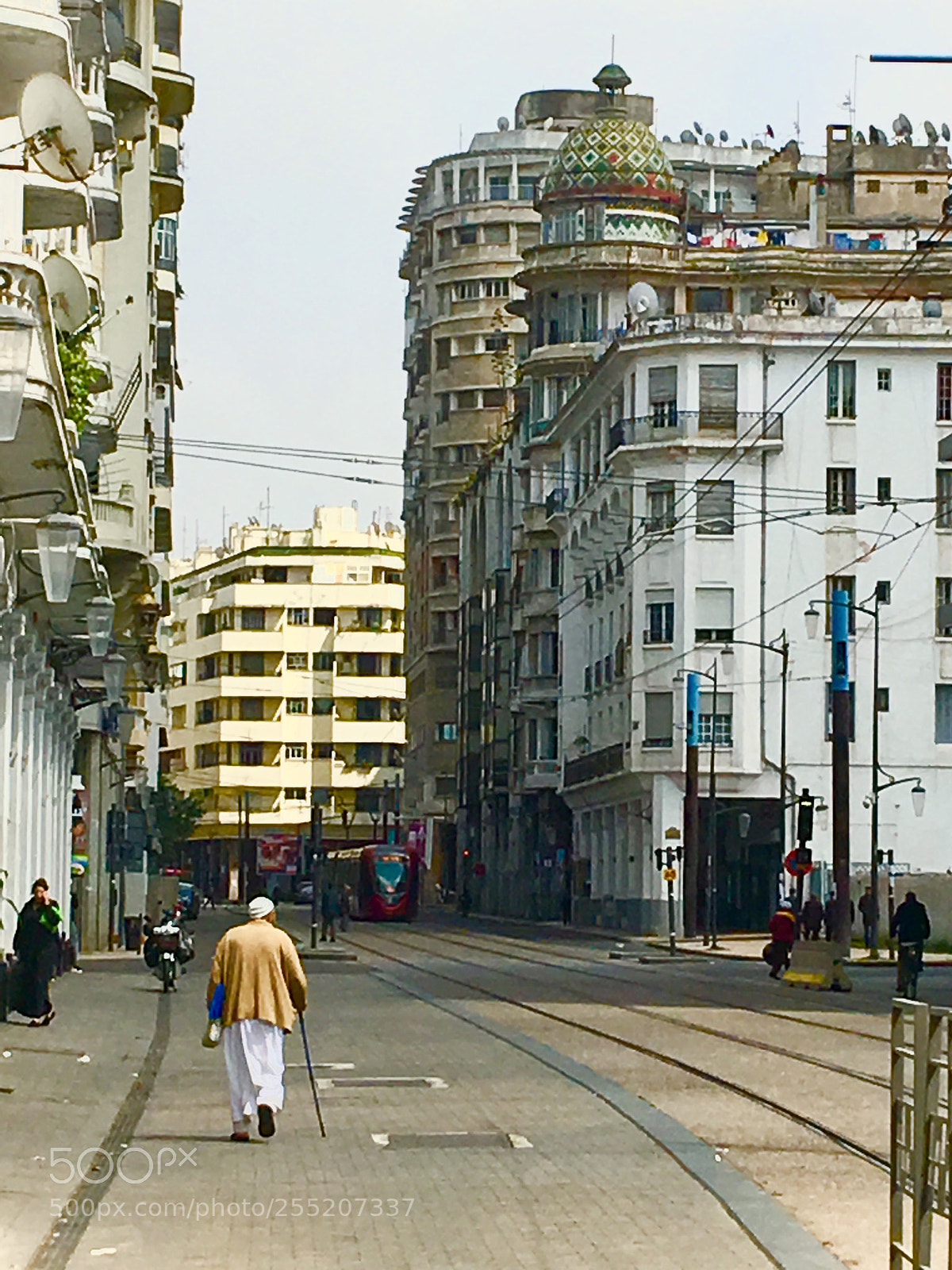 Apple iPhone 6s Plus sample photo. Man walking the streets photography