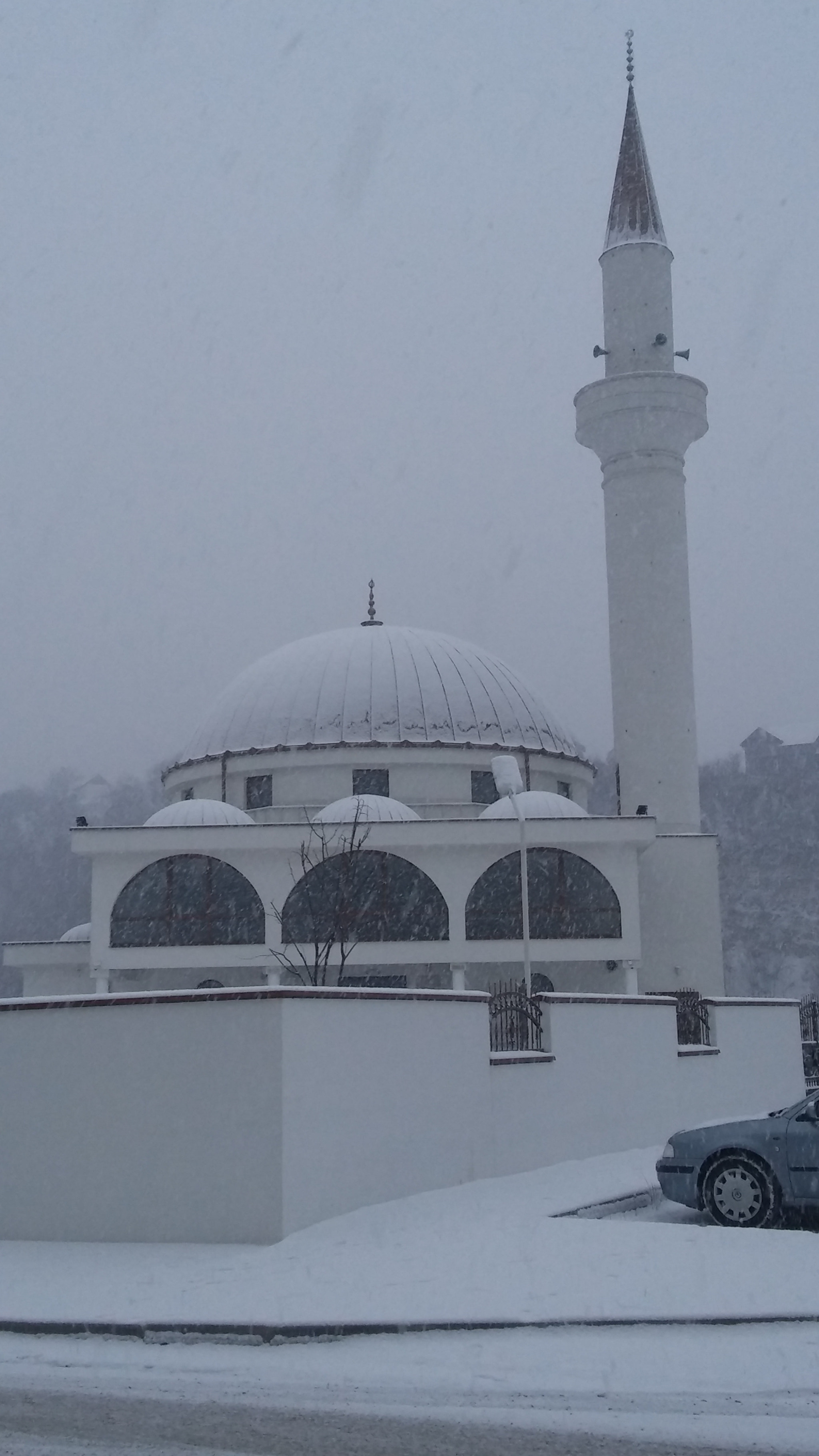 LG H650E sample photo. Minaret in snow photography