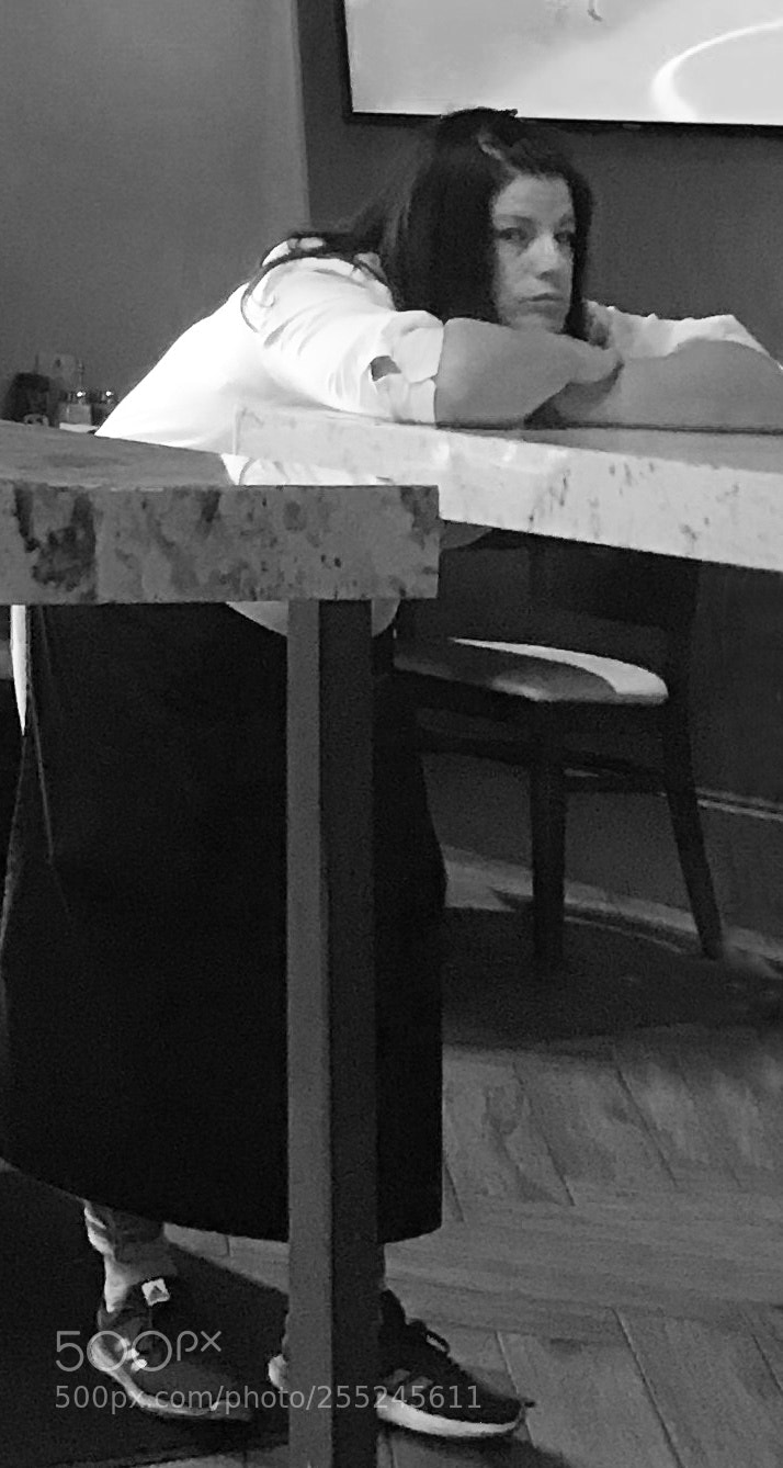 Apple iPhone 7 Plus sample photo. Waitress bored while waiting photography