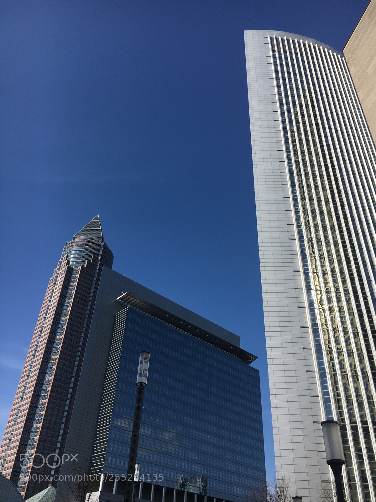 Apple iPhone 6s sample photo. Messeturm behind the building photography