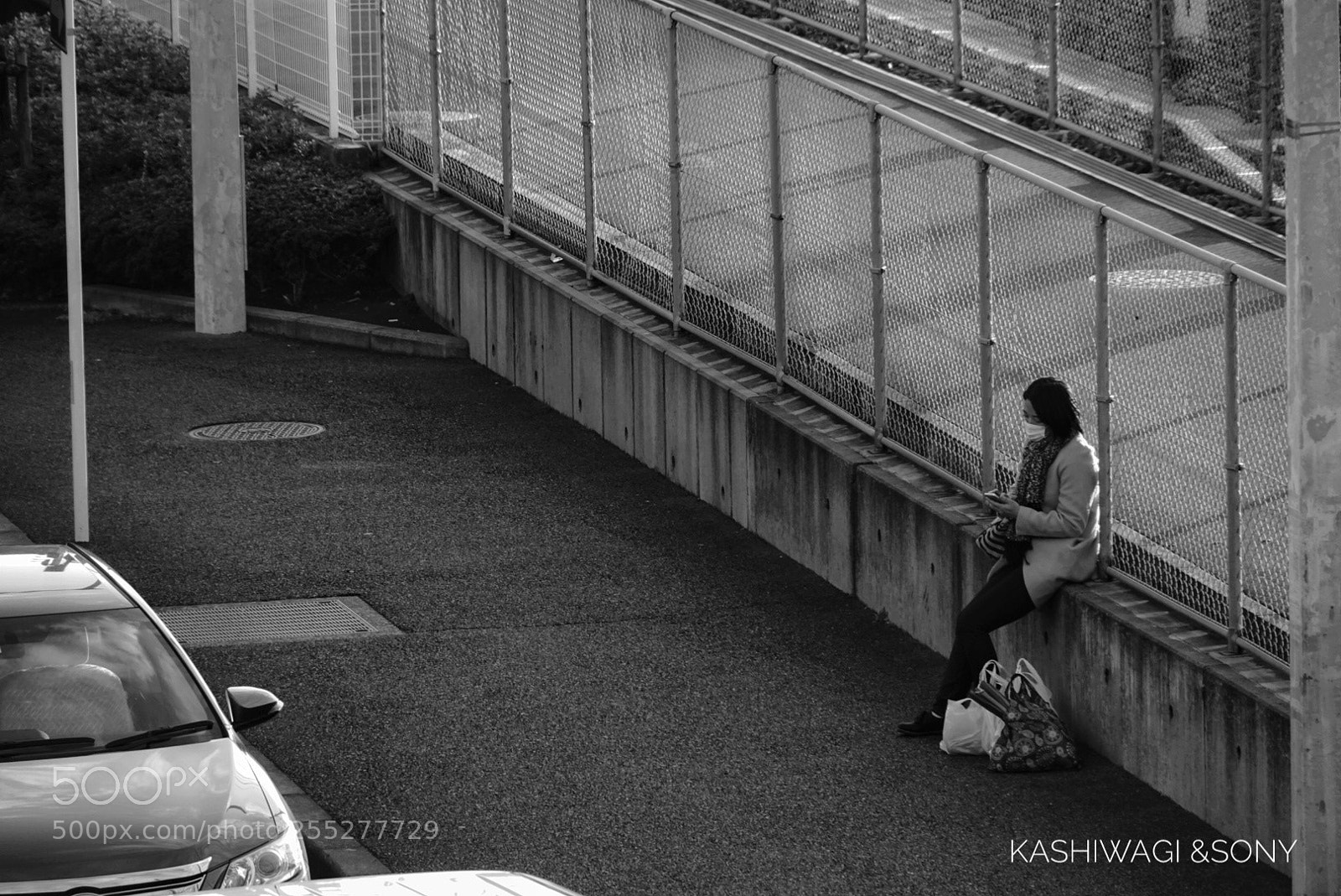 Sony a6000 sample photo. A woman waiting in photography