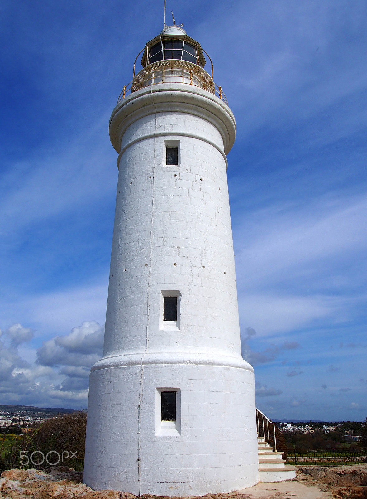 Olympus PEN E-PL6 sample photo. The famous historic white lighthouse in paphos cyprus with bright blue sky and beautiful clouds photography