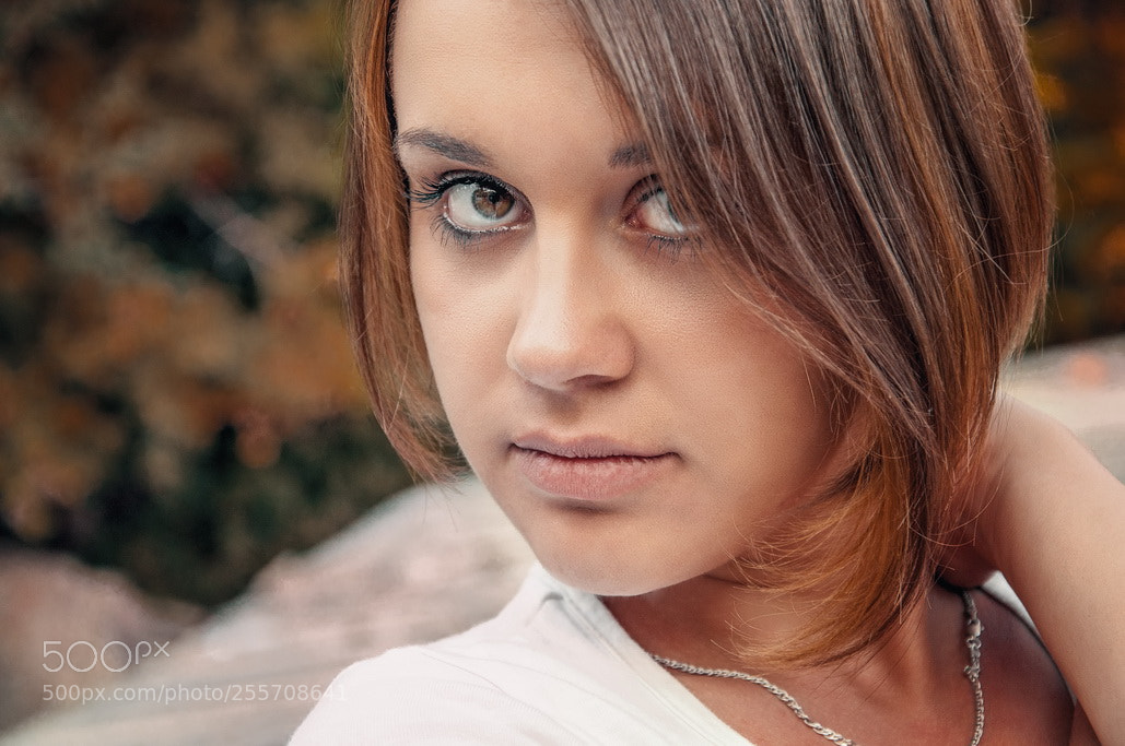 Nikon D90 sample photo. Young woman looks at photography