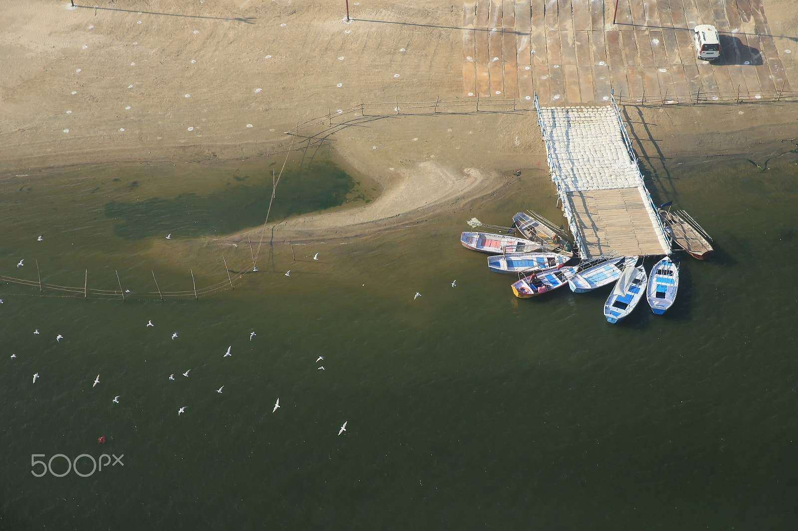 Canon EOS-1D X sample photo. Boats in beach photography