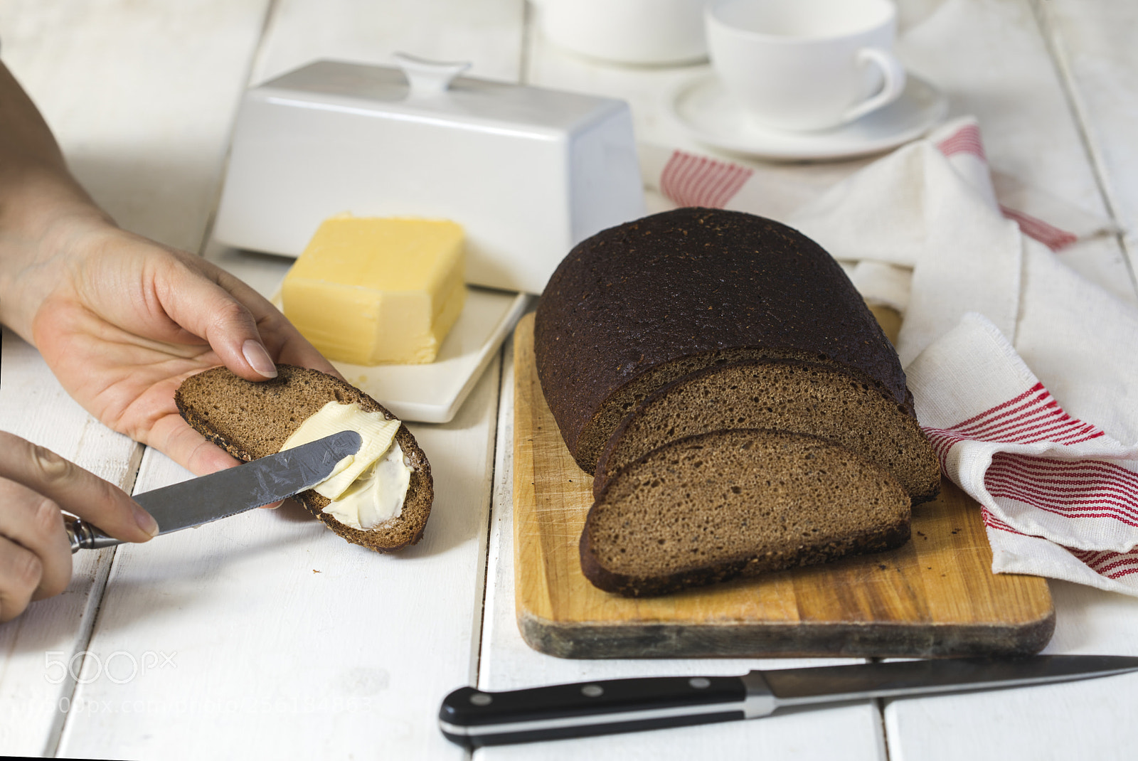 Canon EOS 5D Mark IV sample photo. Woman hand spreading butter photography