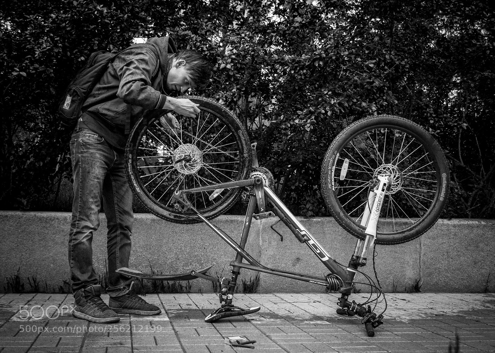 Sony a6000 sample photo. Repairing a bike photography