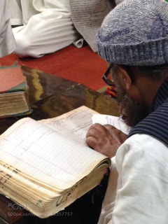 Apple iPhone 5 sample photo. Sufi man reading photography