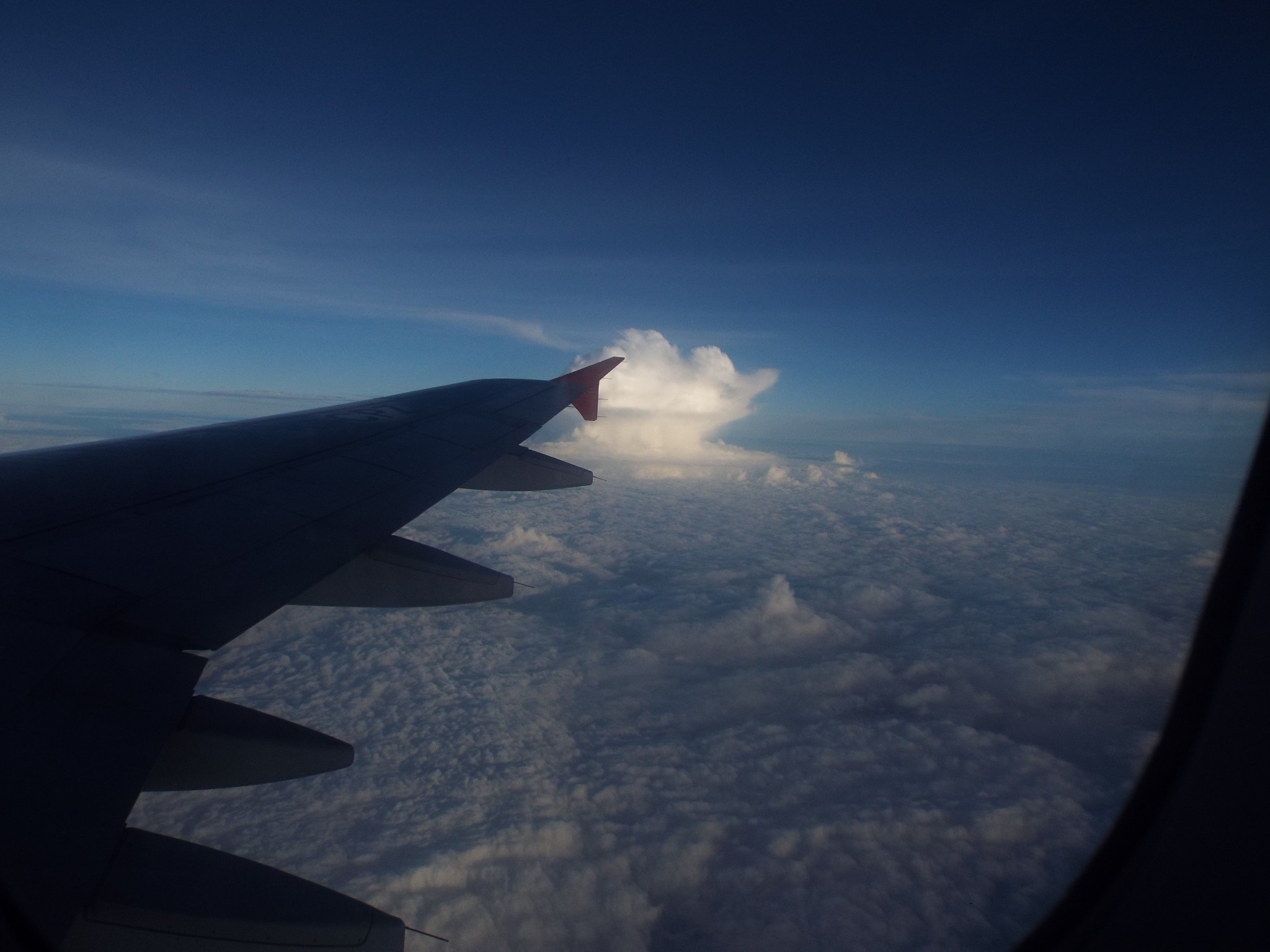 Fujifilm FinePix S9400W sample photo. Cloudy flight photography