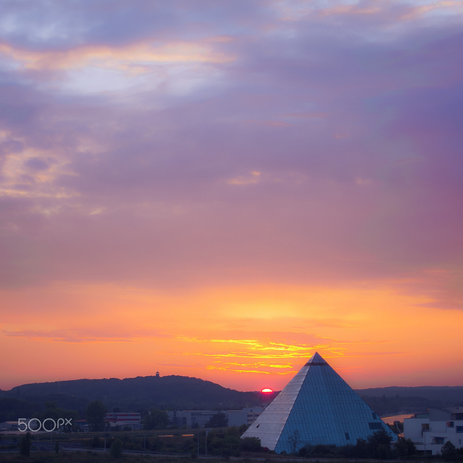 Canon PowerShot S95 sample photo. Pyramide hotel in nuremberg with landscape surrounding it with a great sunset photography