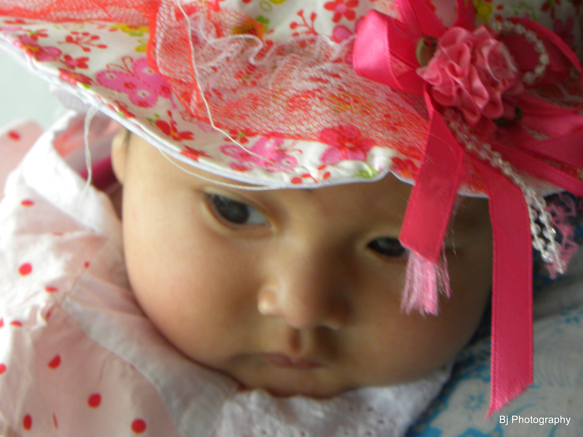 Nikon Coolpix P90 sample photo. Baby in pink hat photography